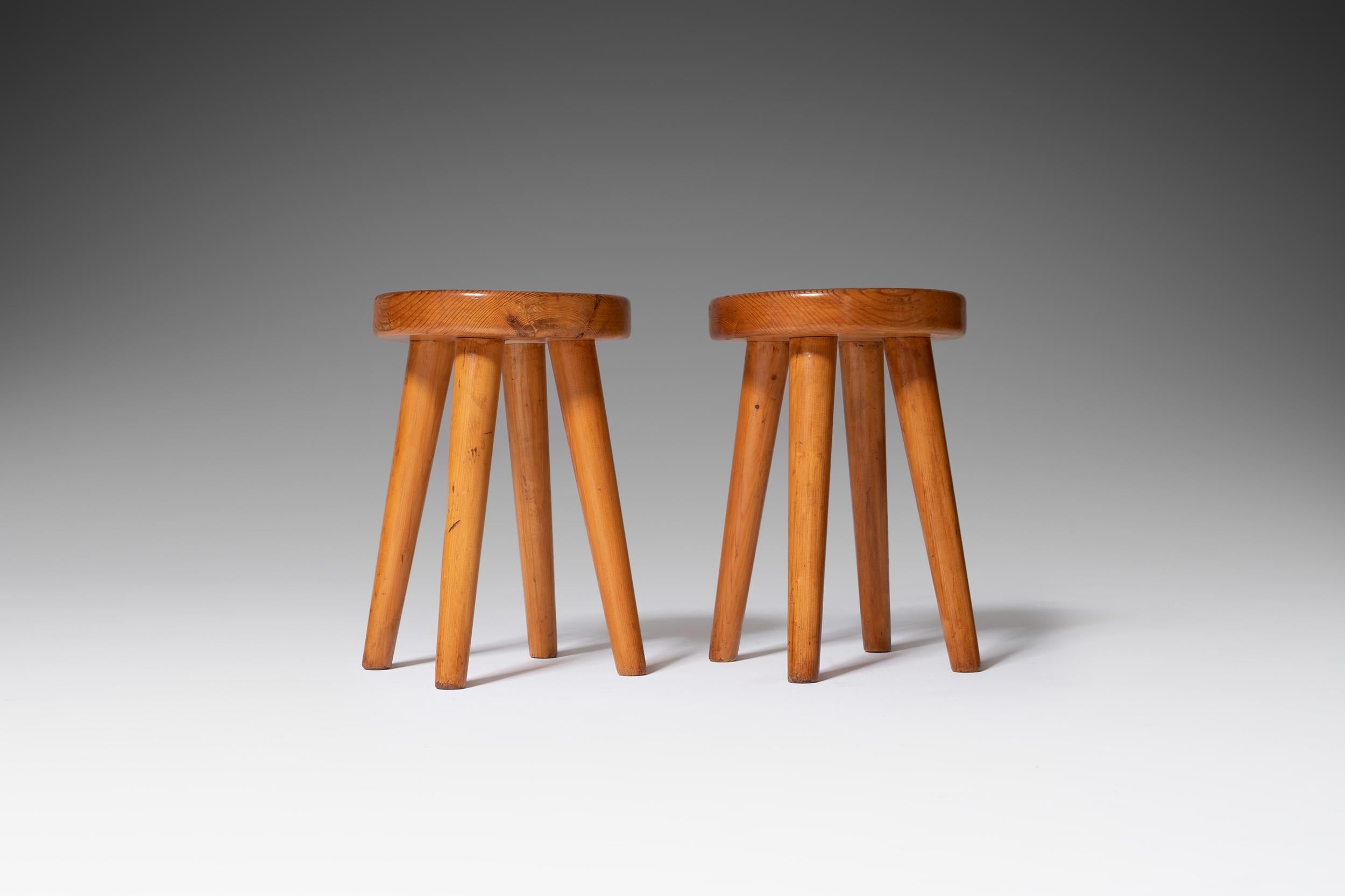 Pair of four-legged French stools in the style of Charlotte Perriand for the Les Arcs Ski resort.
The solid pine stools shows an incredible patina.