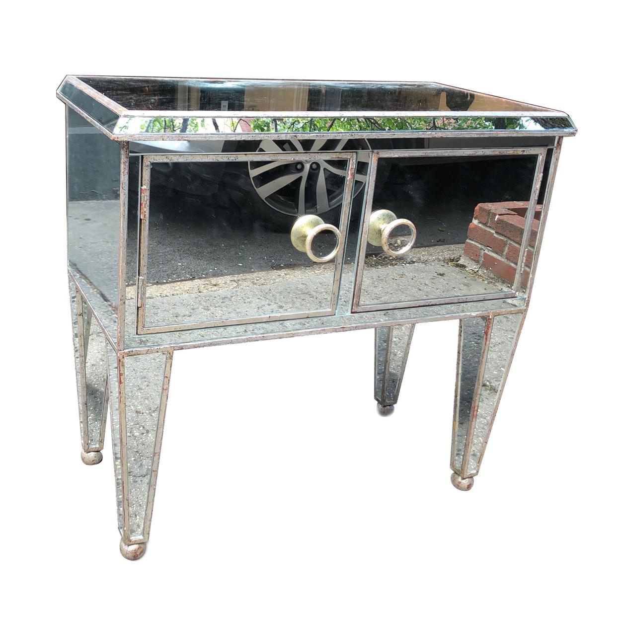 Pair of French circa 1950s silver leaf and mirror wooden cabinets with original patina.

Measurements:
Height 33.5
