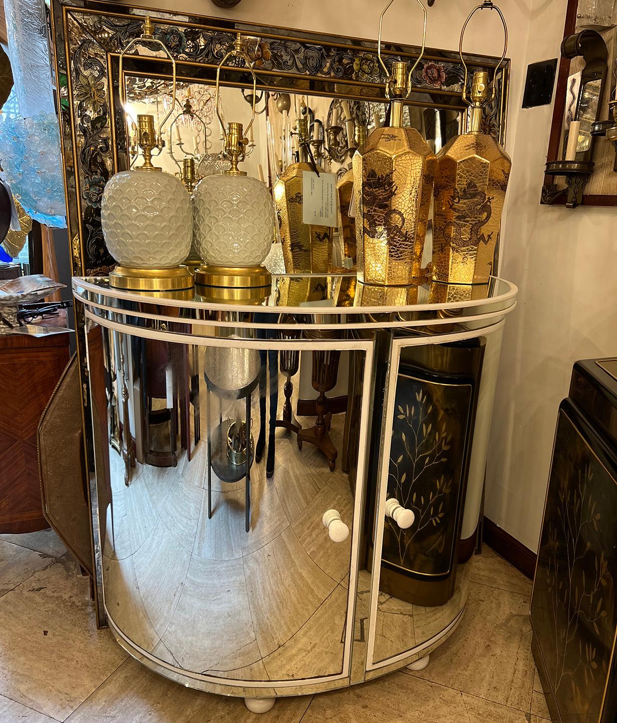 Pair of circa 1950s French mirrored cabinets with original finish.

Measurements:
Height: 36