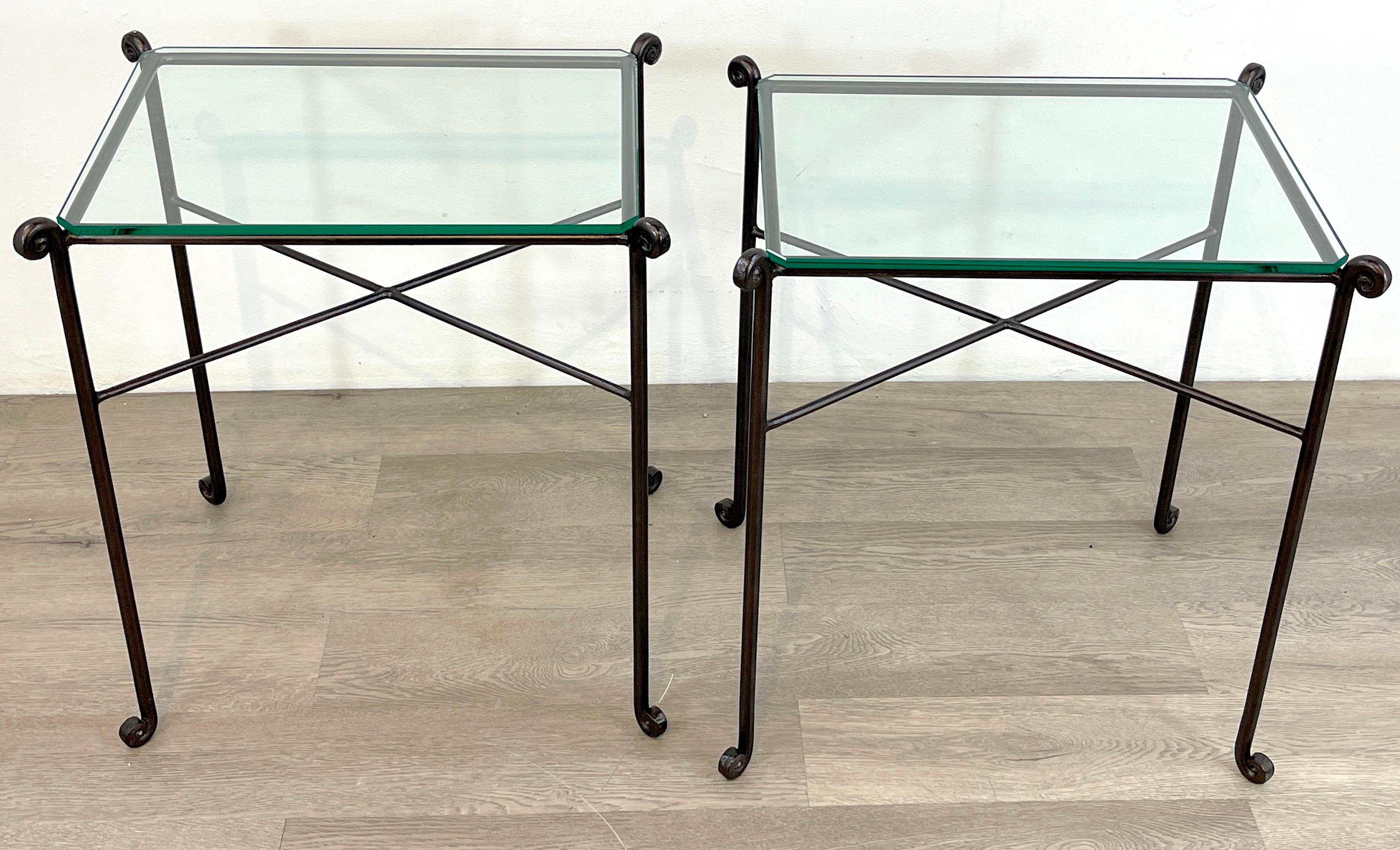 Pair of French modern bronzed iron garden tables, each one with diminutive scroll corners and legs, fitted with finely cut corners and subtly beveled glass tops, ( 19