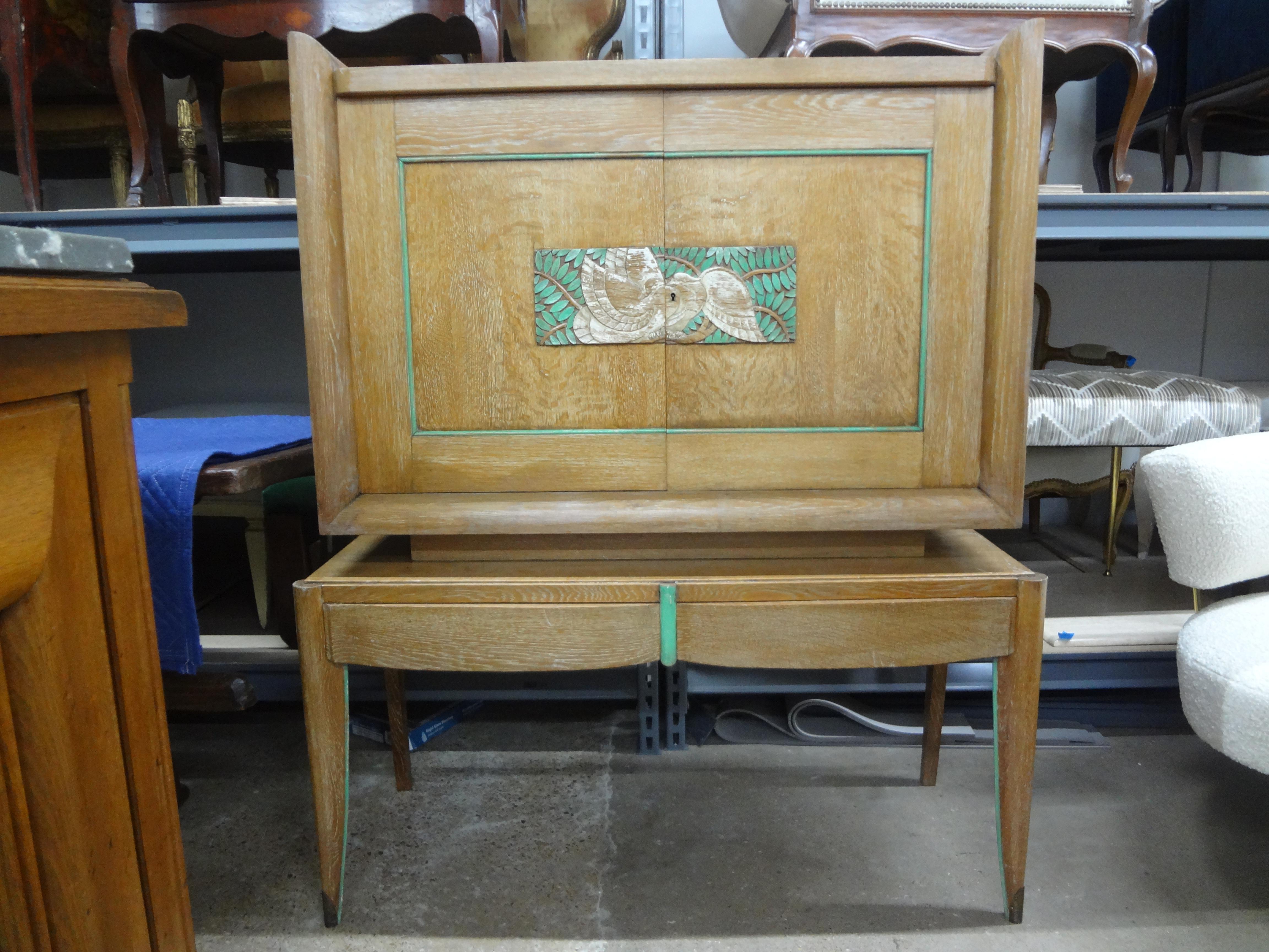 Pair Of French Modern Cerused Oak Cabinets.
This rare pair of French Art Deco cerused carved and painted cabinets have two doors above two drawers on shapely legs terminating in bronze sabots.
Each cabinet has a shelf and retains the original locks