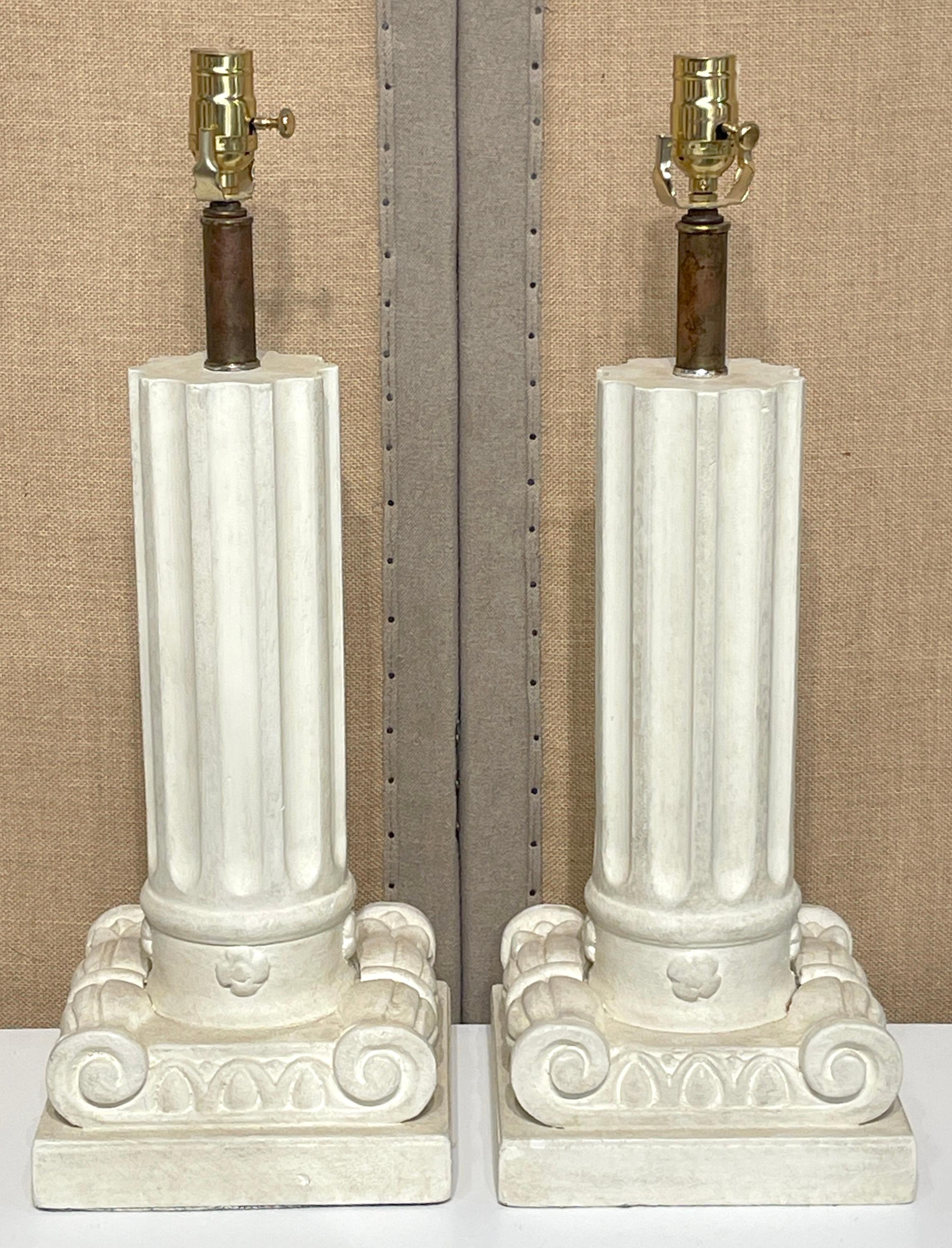 Pair of French Modern Serge Roche-style wood and plaster inverted column lamps 

A beautiful pair of French Modern lamps in the style of the renowned mid-century designer Serge Roche. These exquisite pieces feature an architectural design, with each