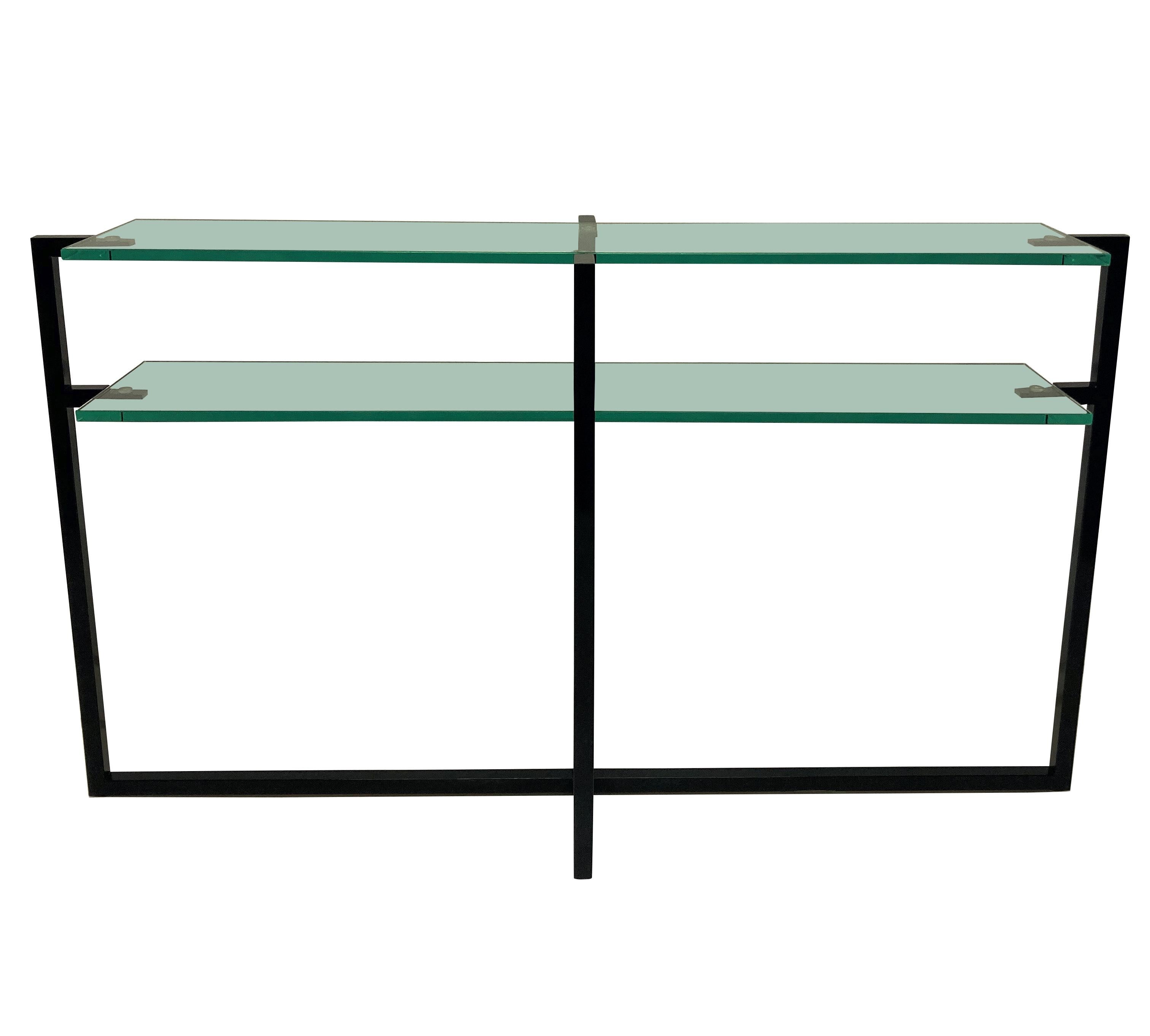 A matched pair of French modernist console tables, in black hand lacquered steel, each with double shelves in thick plate glass.