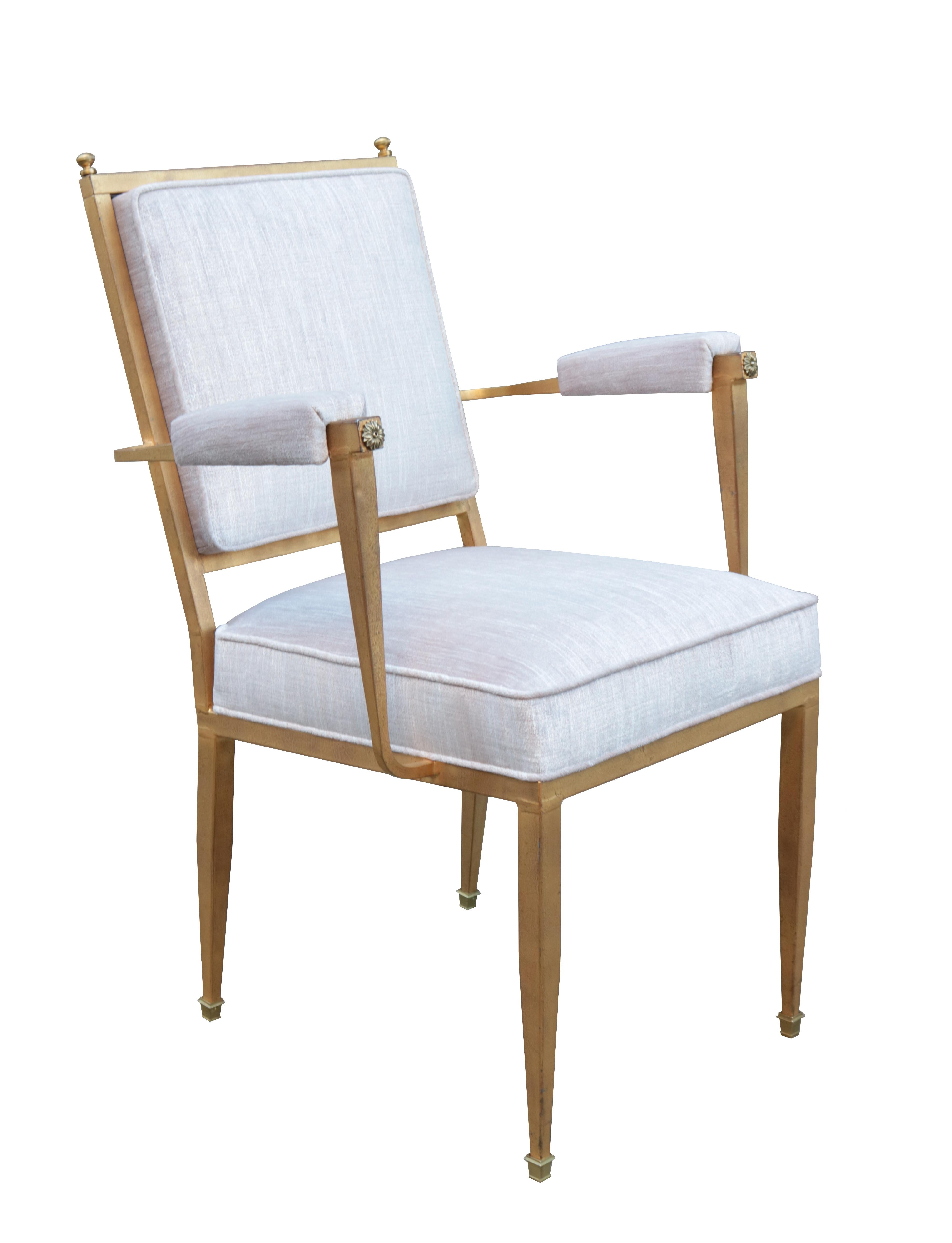 A pair of French modernist armchairs.
Gilt metal with upholstered seat, back and armrests.