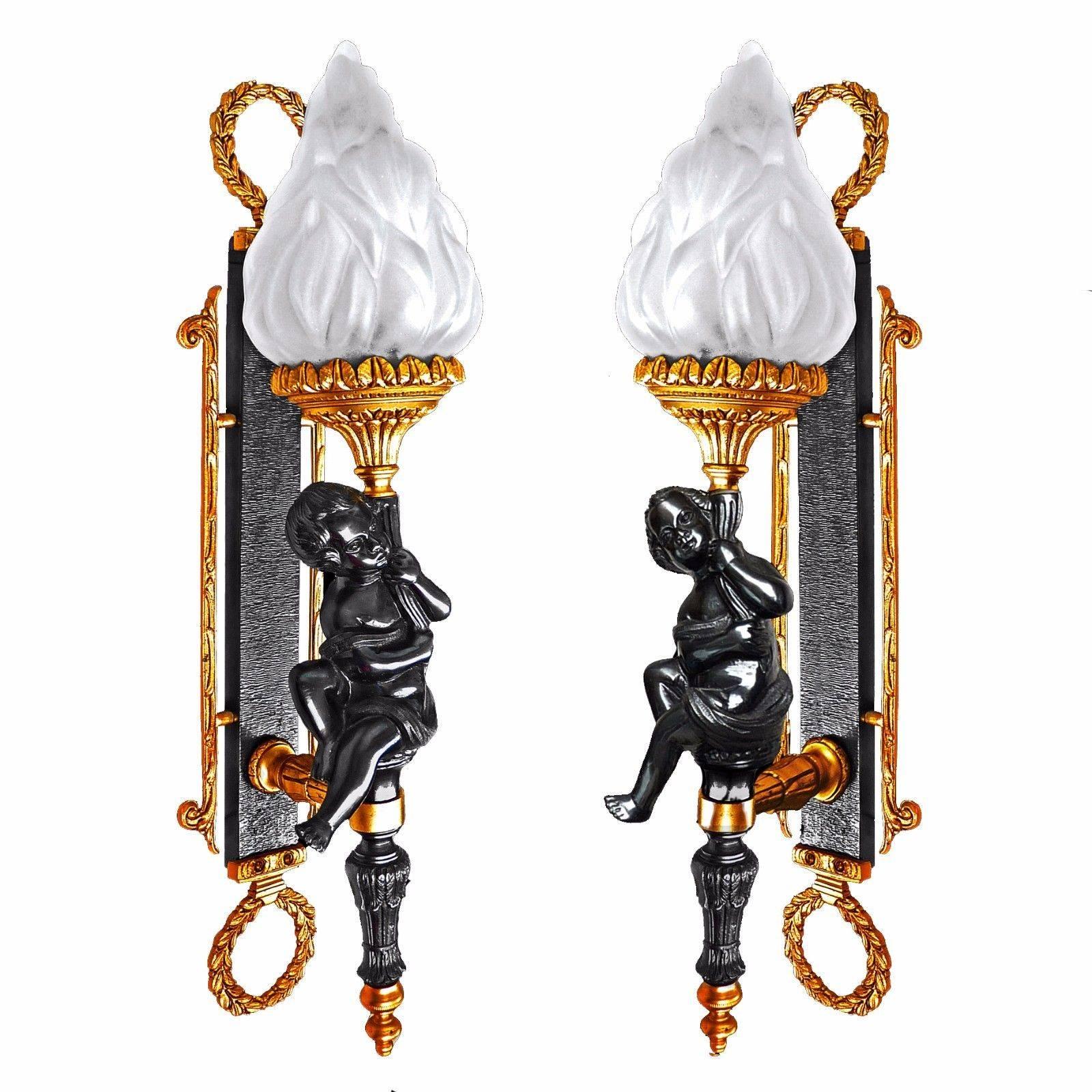 Gorgeous and heavy neoclassical impressive pair of French Empire wall light sconces. Patinated cast bronze cherubs and gilt bronze with frosted glass torch / bronze doré.
Measures:
Height 22 in (55 cm)
Width 6 in. (15 cm)
Depth 8 in. ( 20