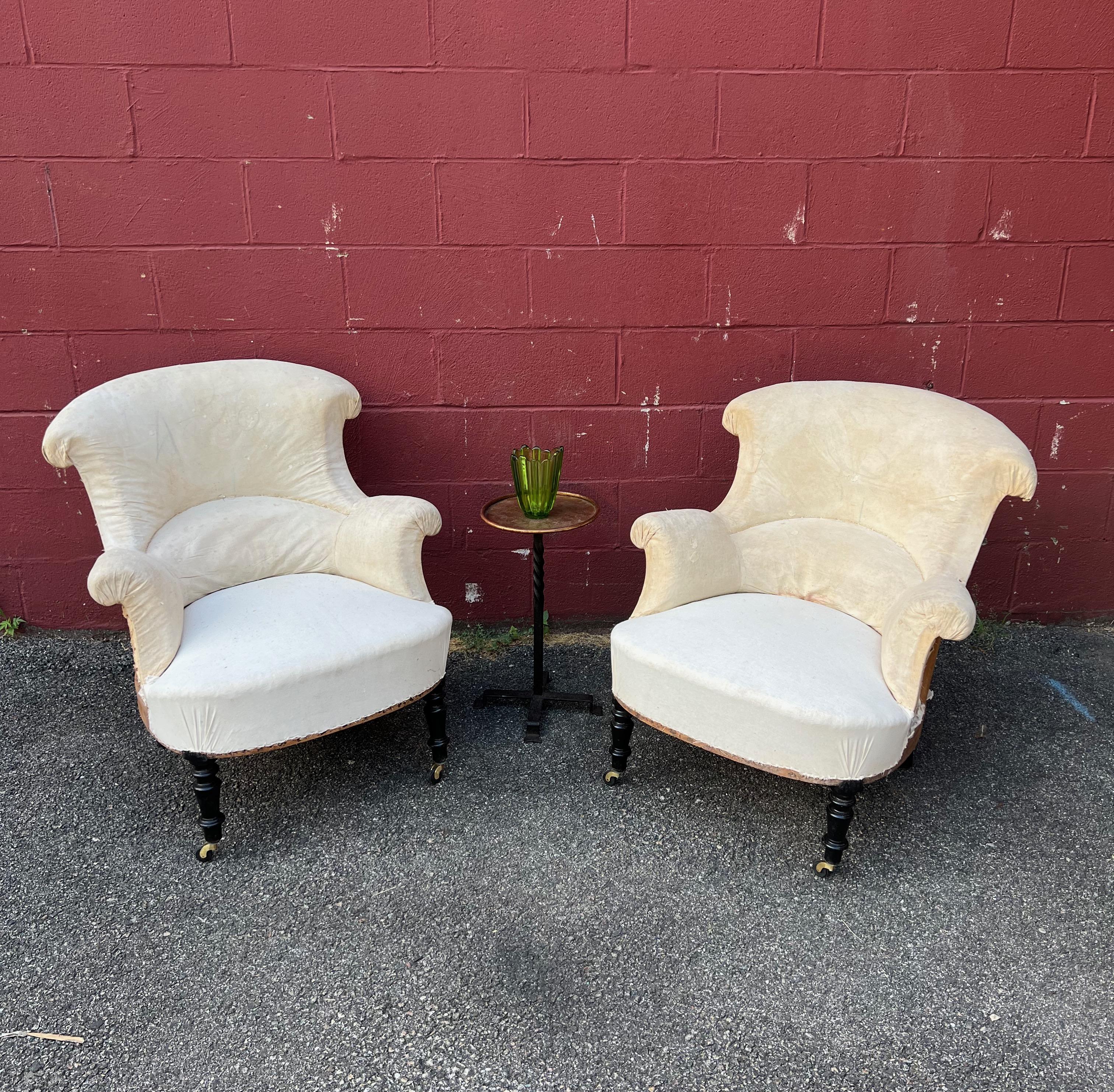 An exquisite pair of French 19th century Napoleon III style armchairs that embody the timeless elegance of this iconic era. These chairs are designed with impeccable proportions, featuring a generously curved back that offers outstanding lumbar