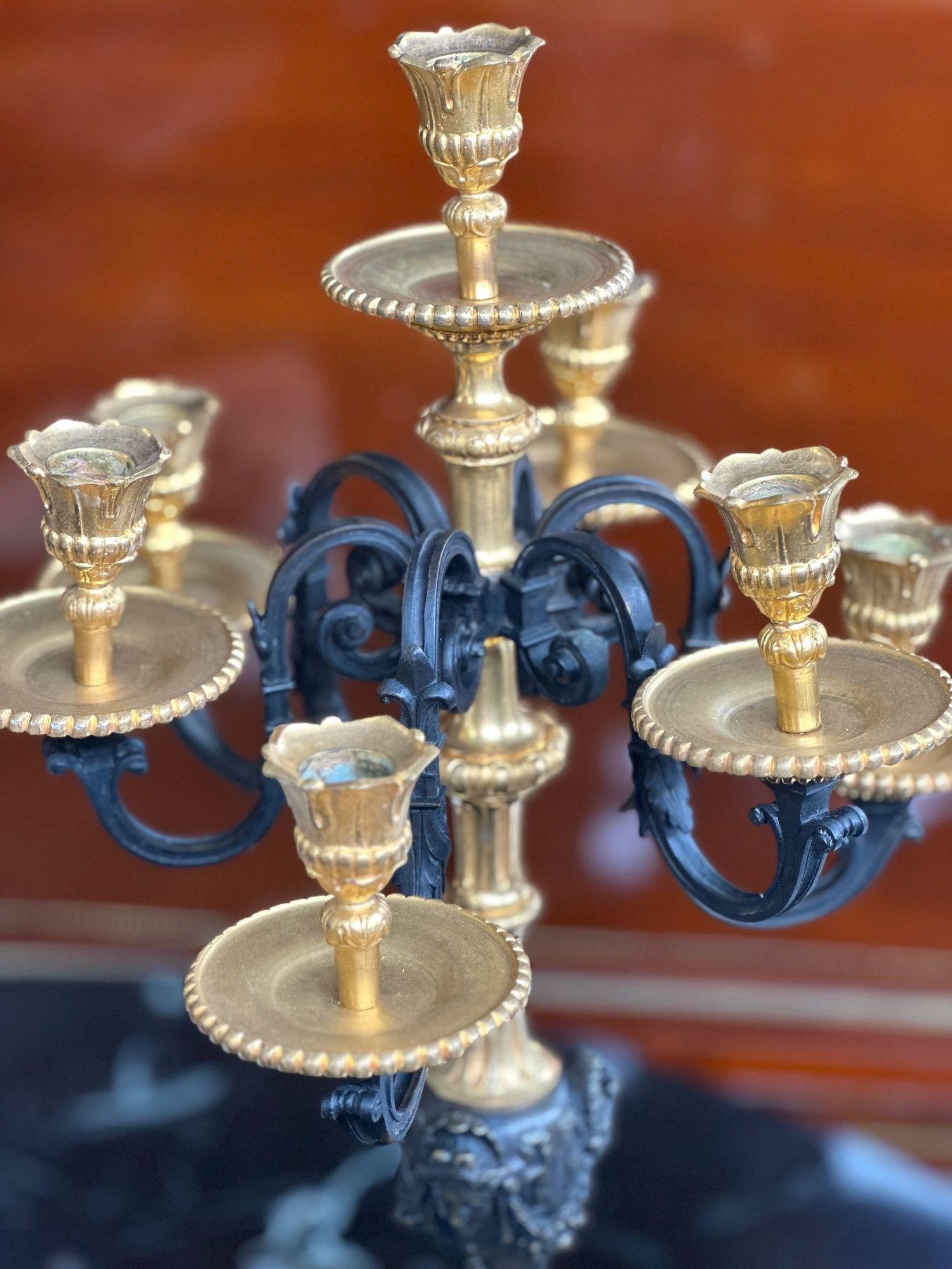 Pair of French Late 19th Century Napoleon III style candelabras with patinated and gilt bronze and rouge marble bases. In the manner on Henri Picard. 
*Stamped bobèches
Dimensions:
29.5