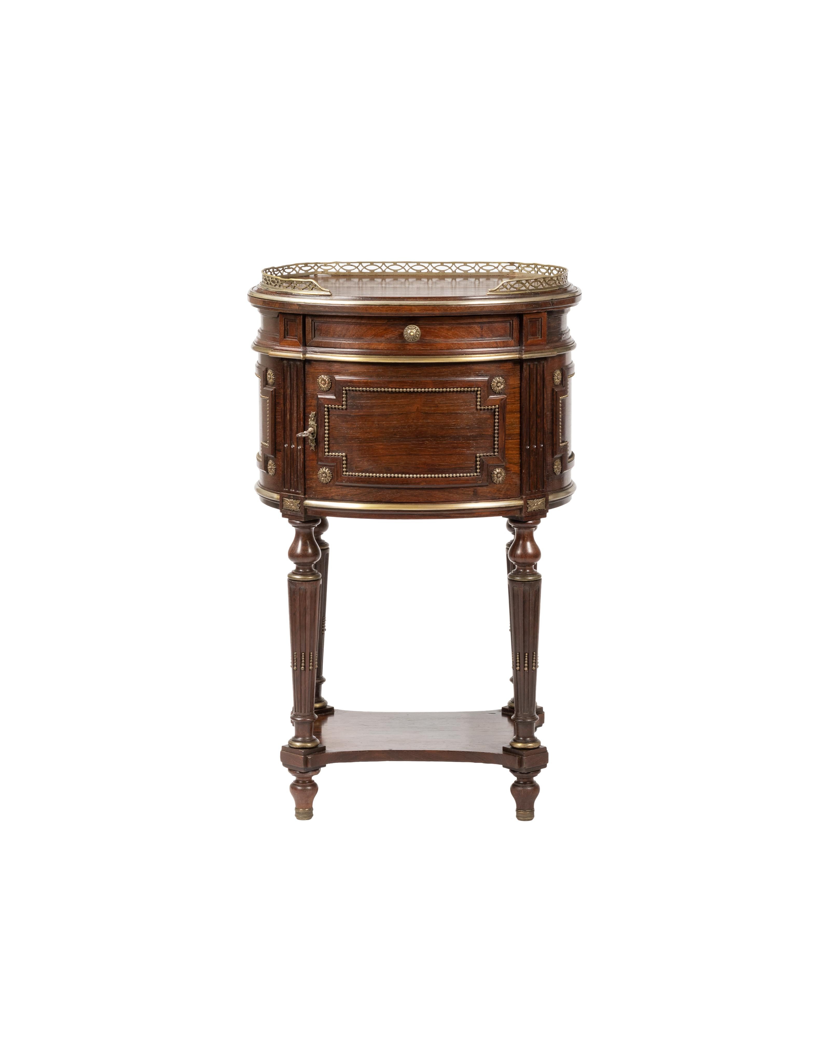 This rare pair of 19th-century Napoleon III bedside tables showcases exquisite French craftsmanship in solid high-quality wood. 
Designed for palatial interiors, these heavy, hand-carved nightstands feature a refined marble interior, adding to their