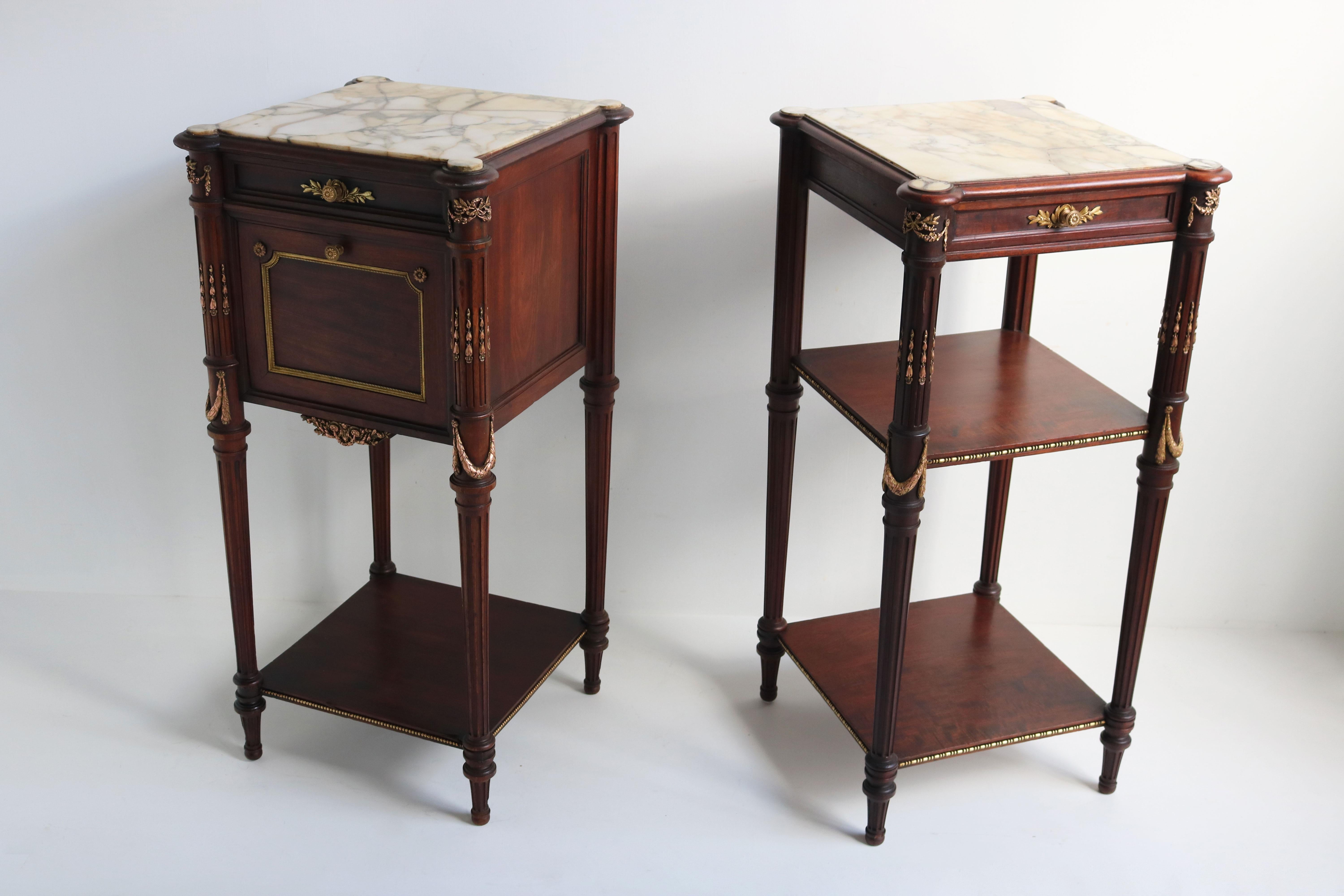 Exquisite pair of 19th century French Napoleon III night stands. Such a gorgeous & luxurious asymmetrical couple !
Made out of Mahogany and decorated with gilded bronze ornaments , minor carved details & uniquely shaped marble tops. 
One night