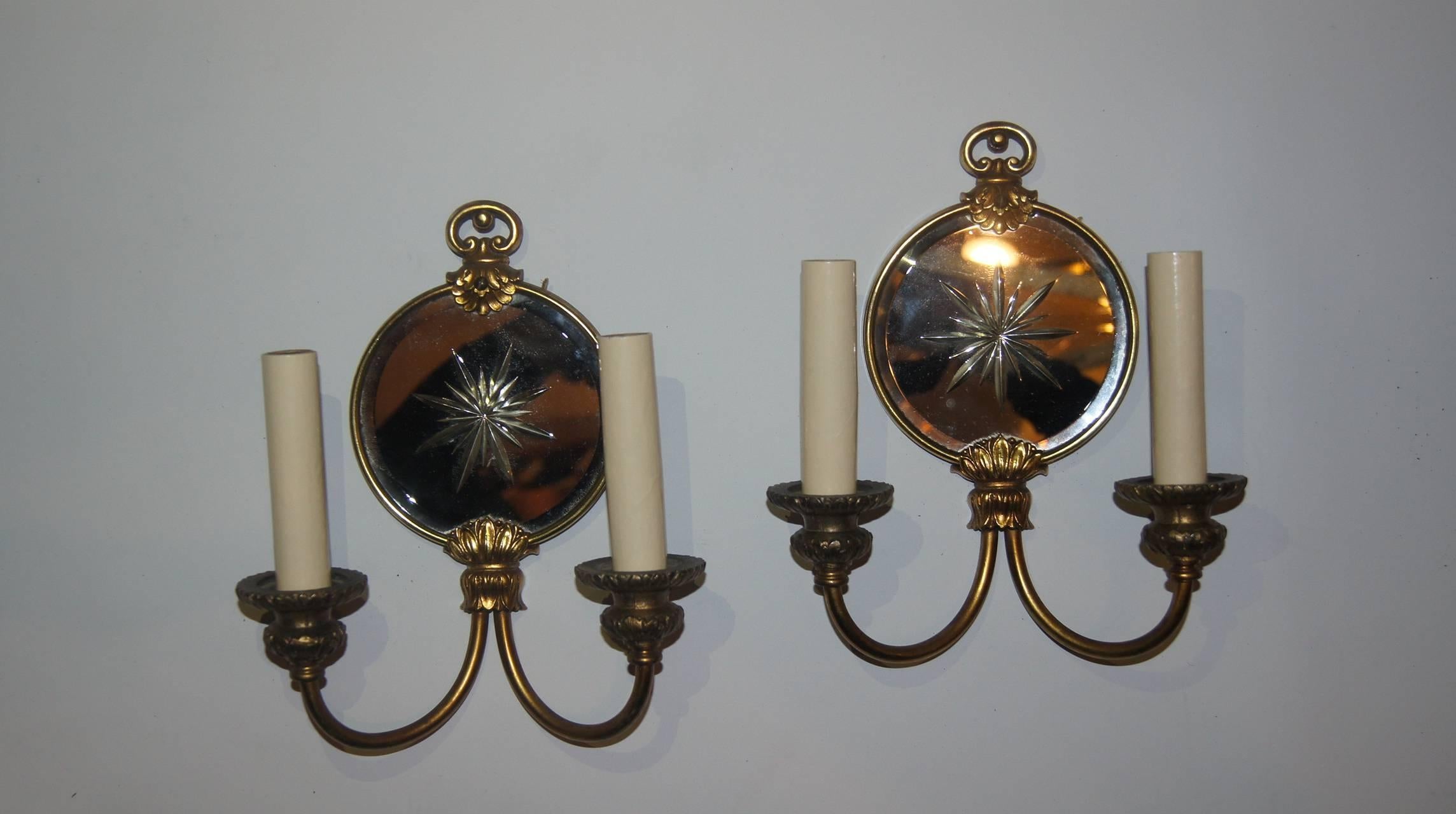 Pair of French 1930s neoclassic style two-light sconces with etched mirrored back.

Measurements:
Height 10