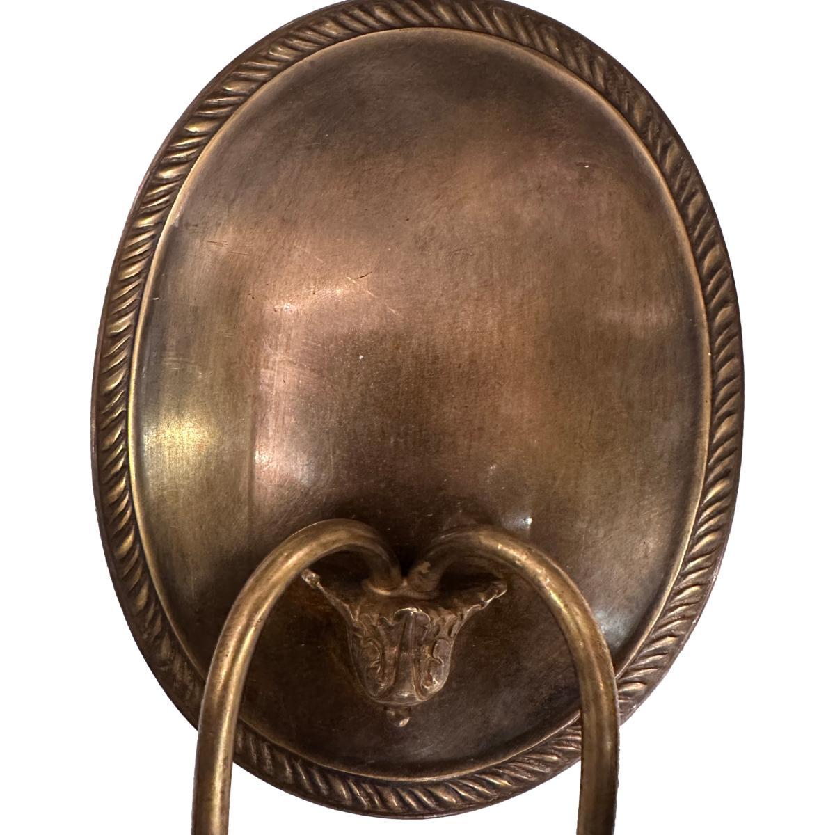 Pair of circa 1940's French bronze oval neoclassic style sconces.

Measurements:
Height: 9