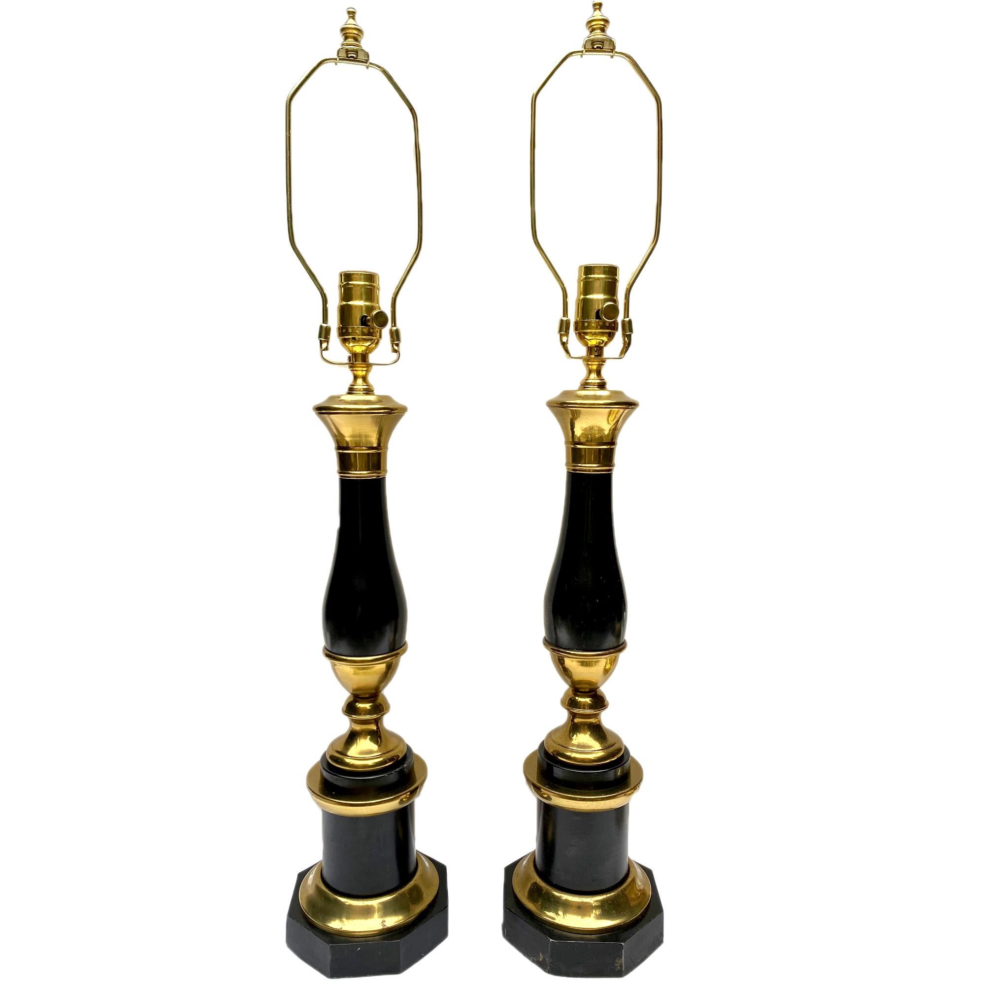 A pair of circa 1940's French painted and gilt table lamps with original patina.

Measurements:
Height of body: 17.5