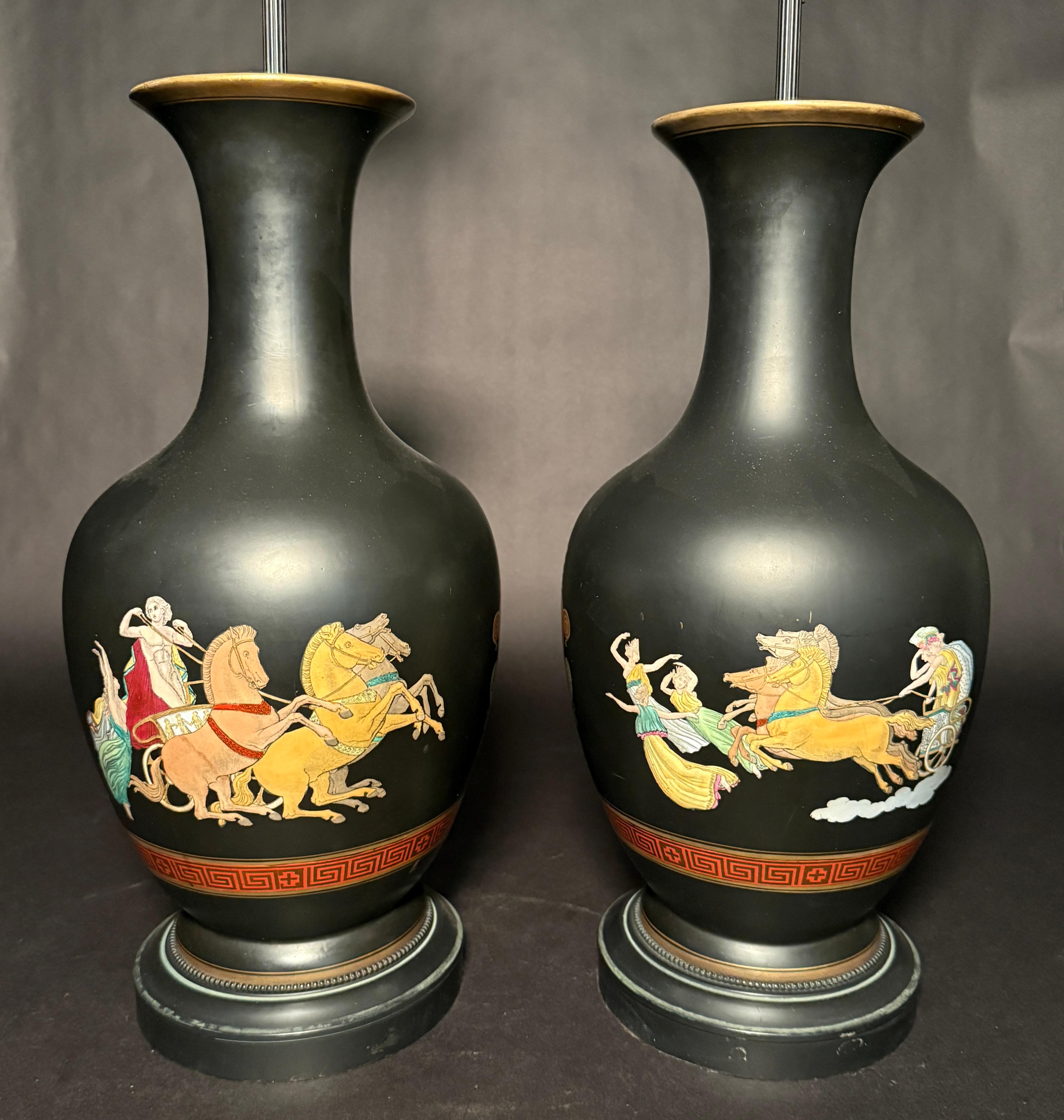 A striking pair of French black-ground porcelain vases, now mounted as table lamps, attributed to Samson, Edmé et Cie, Paris, circa 1880–1900. Each vase is crafted in the Neoclassical taste with a rich matte black glaze and hand-painted enamel
