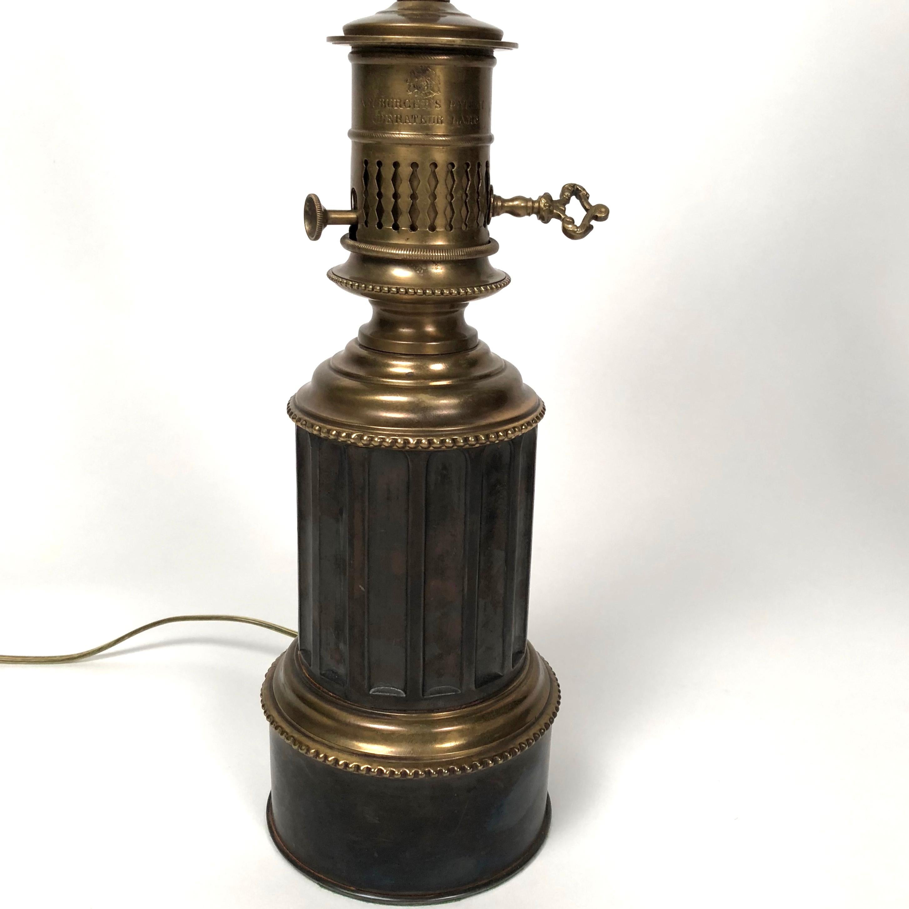 A pair of fine quality 19th century French neoclassical fluted column oil lamps, now electrified, in brass and steel, by Neuberger, Paris, French, circa 1875, with custom made pleated silk shades and brass wreath finials. Signed. Newly