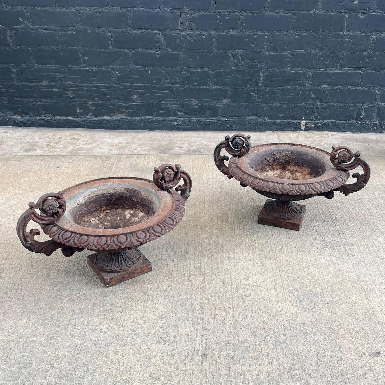 Pair of French Neoclassical Cast Iron Garden Urns

Country: France
Materials: Cast Iron 
Condition: Original Vintage Condition
Style: French Neoclassical
Year: 1920s

$2,895 pair 

Dimensions:
13.50”H x 23.50”W x 18”D
