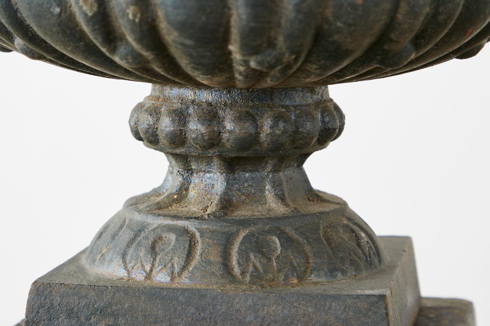 Pair of French Neoclassical Cast Iron Urns on Pedestals 7