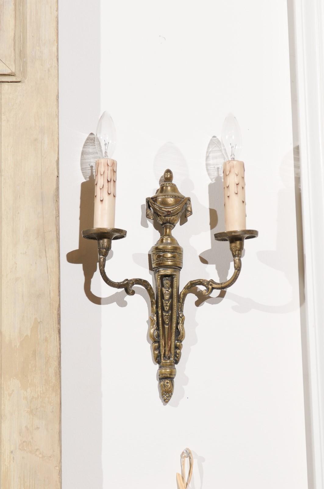 Pair of French Neoclassical Style Bronze Two-Arm Sconces with Draped Urn Finials In Good Condition In Atlanta, GA