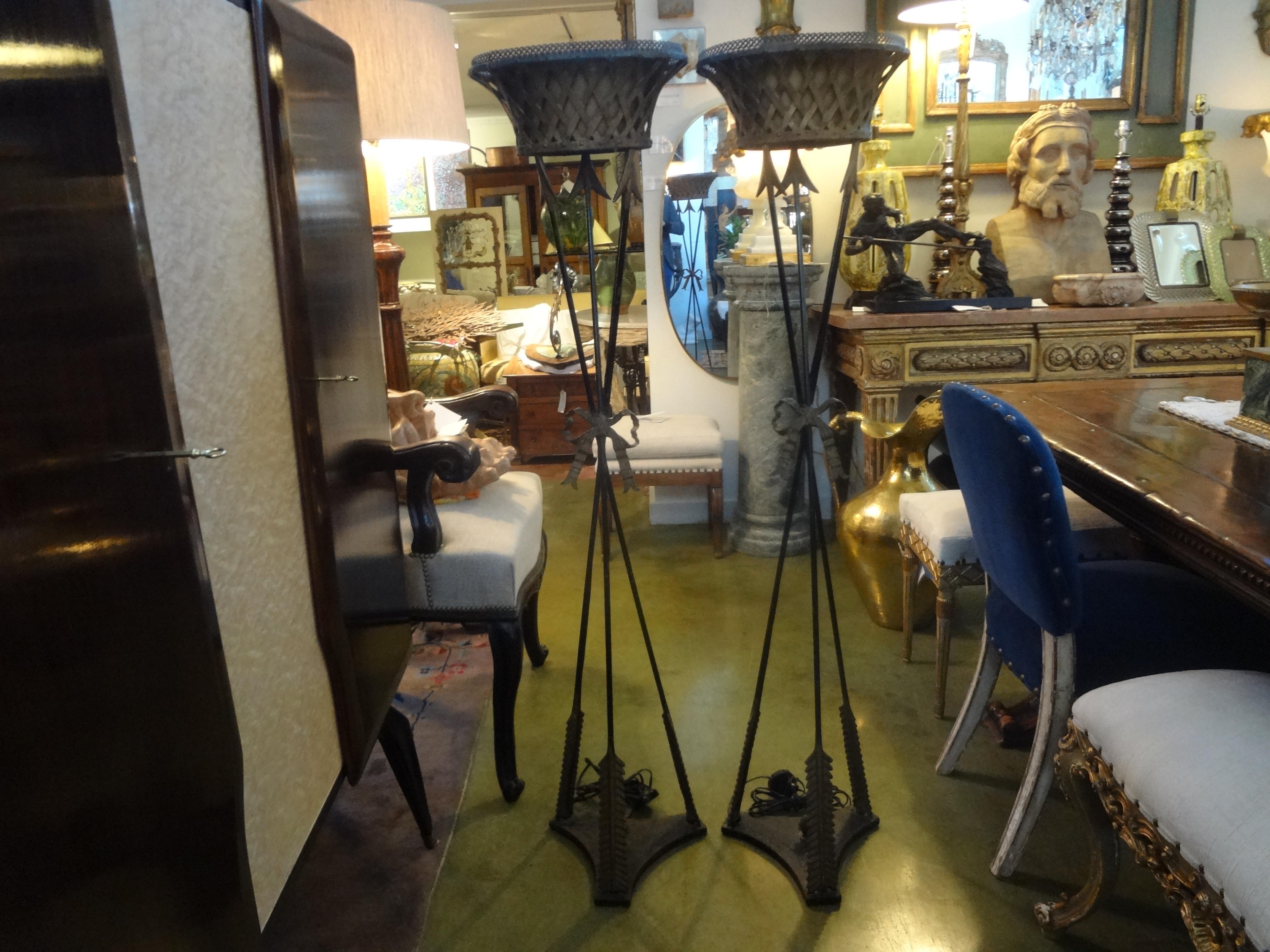 Pair of antique French Neoclassical style iron torchieres.
Stunning pair of French Neoclassical style iron torchères, torchiere, torche`re lamps or floor lamps, circa 1920, possibly earlier. These antique French Louis XVI style uplight floor lamps
