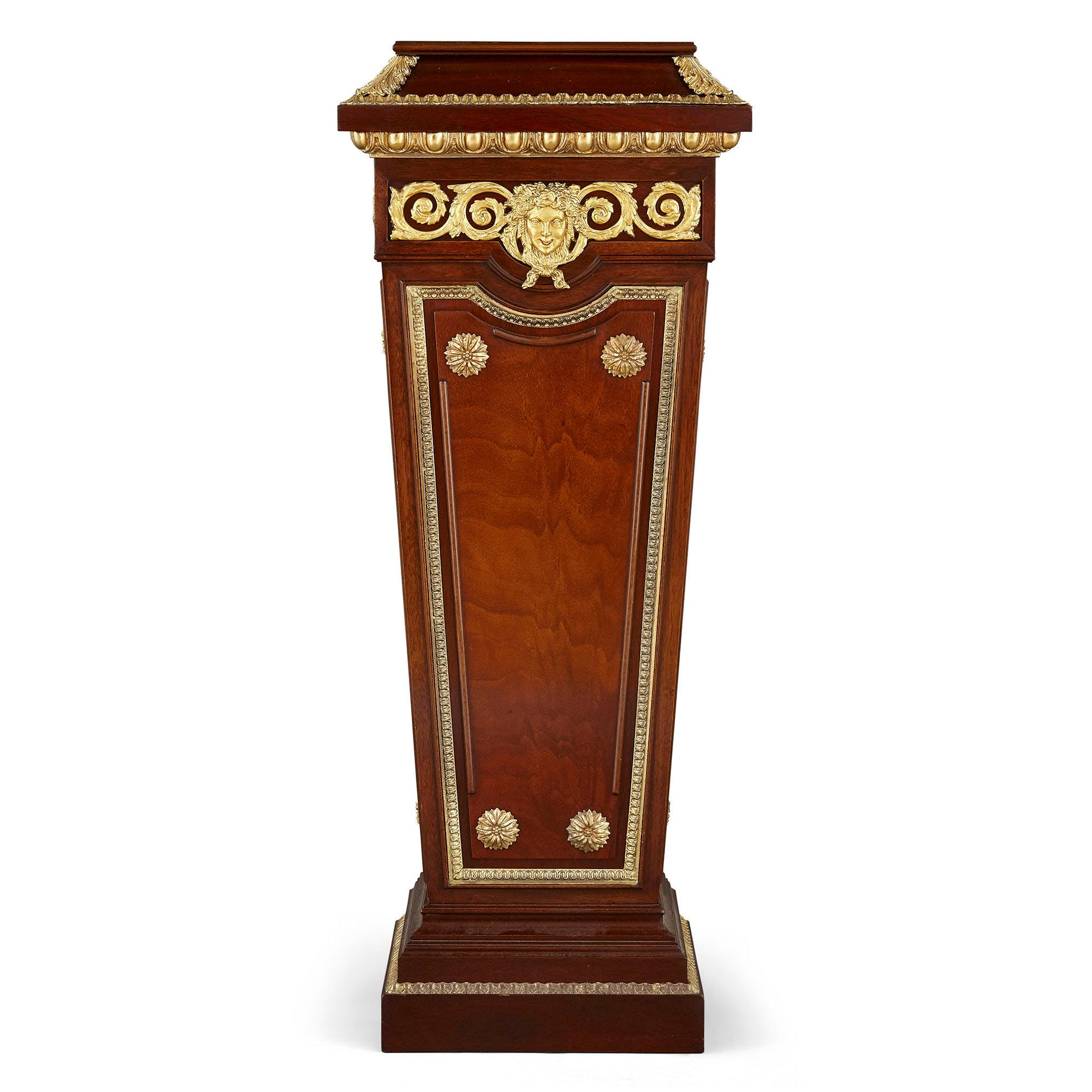 Pair of French Neoclassical Style Parcel Gilt Mahogany Pedestals In Good Condition For Sale In London, GB