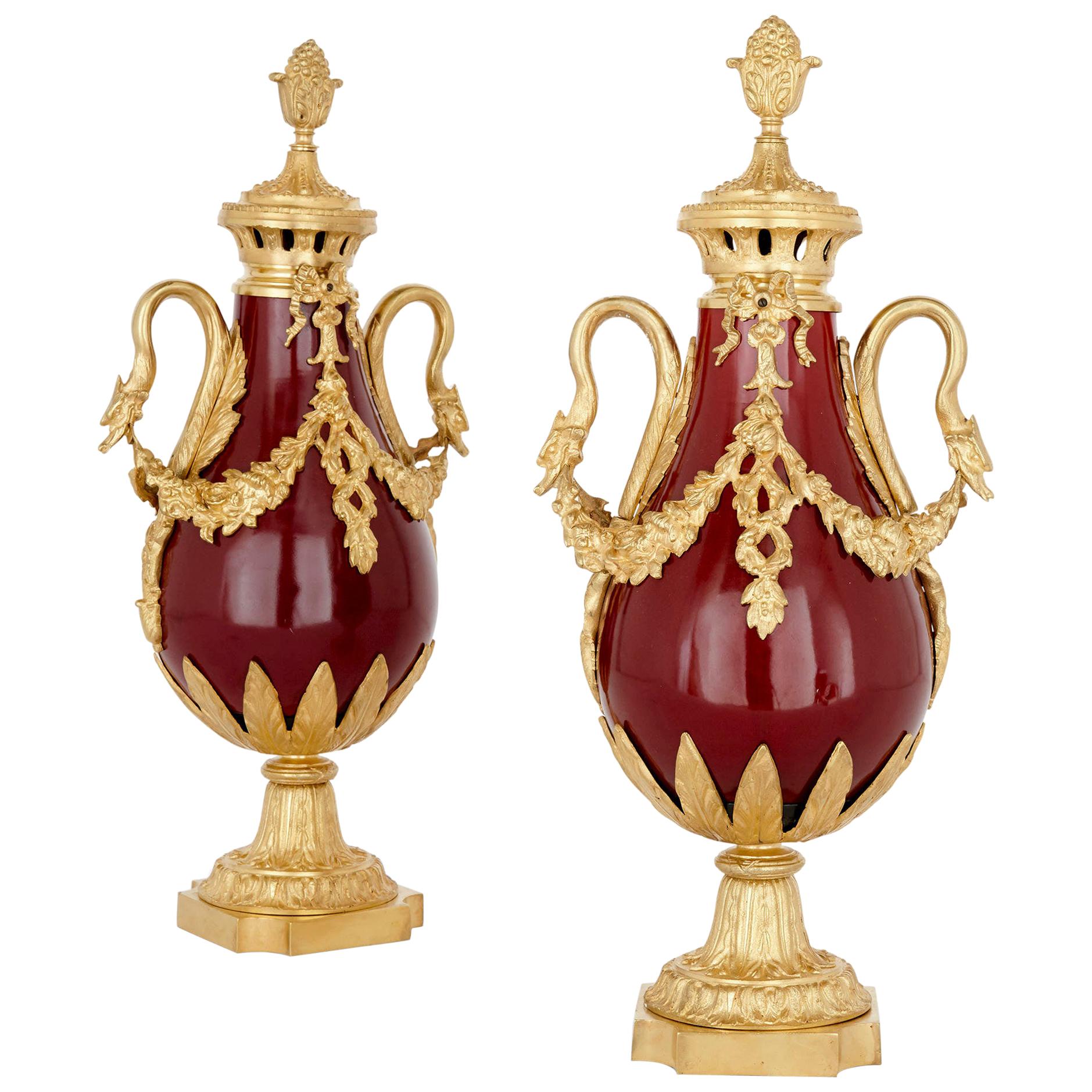 Pair of French Neoclassical Style Red Tôle and Gilt Bronze Vases For Sale