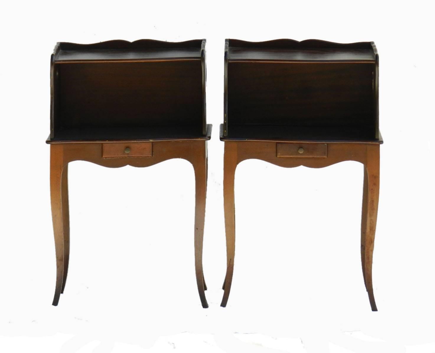 Pair of French Provincial side cabinets 20th century
Bedside table nightstands
Mid-20th century Louis revival
Typical Provincial sweet heart cut-out sides
Each with a very small drawer
Good condition with some marks of use quite usual for their