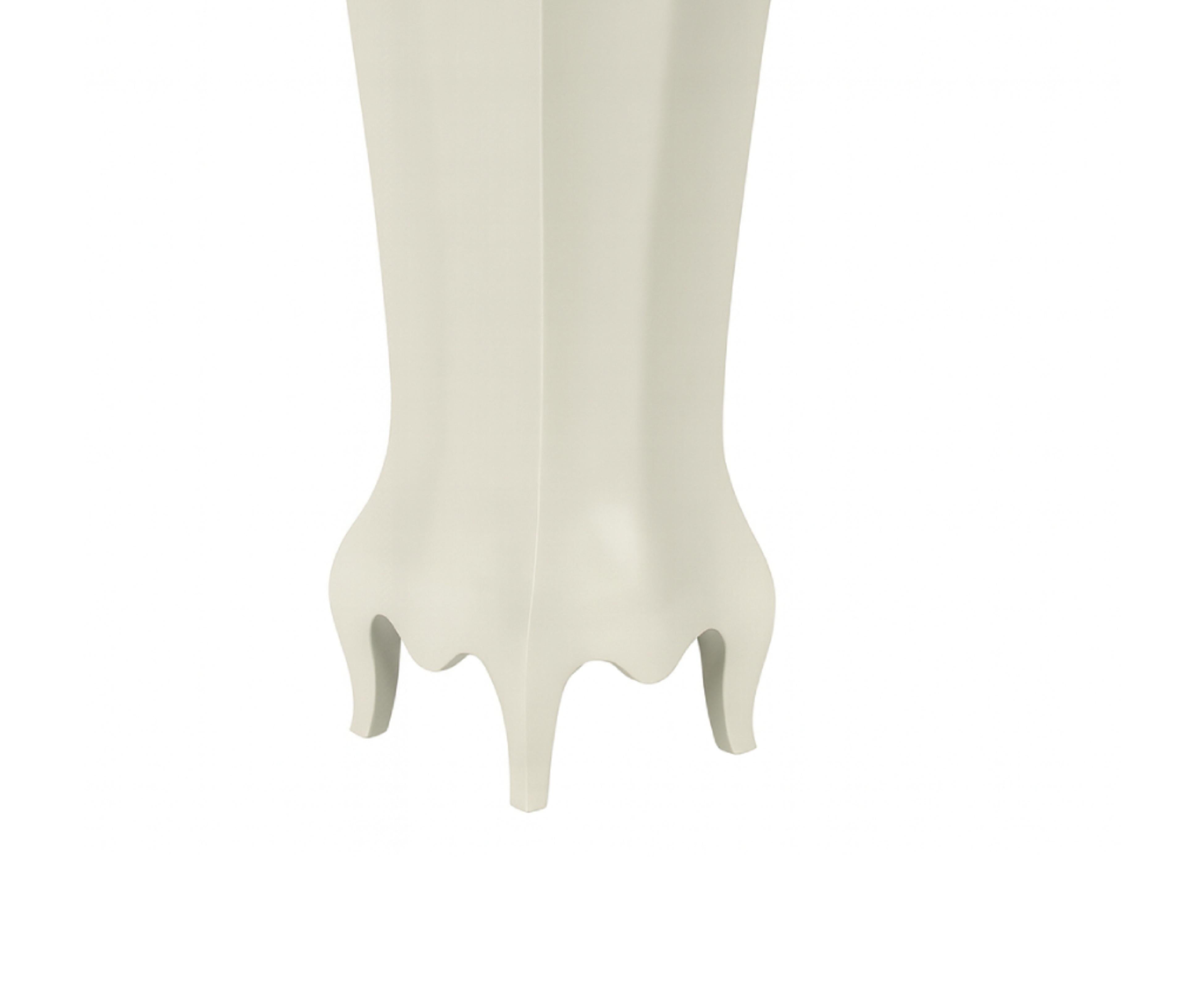 A vibrant pair of pedestals showcasing marble tops, parquetry-patterned curving faces and short feet. 
The decoration is expressive yet refined, combining Louis XV style with Louis XVI refinement. 
The faces feature a  in a sleek off-white lacquer