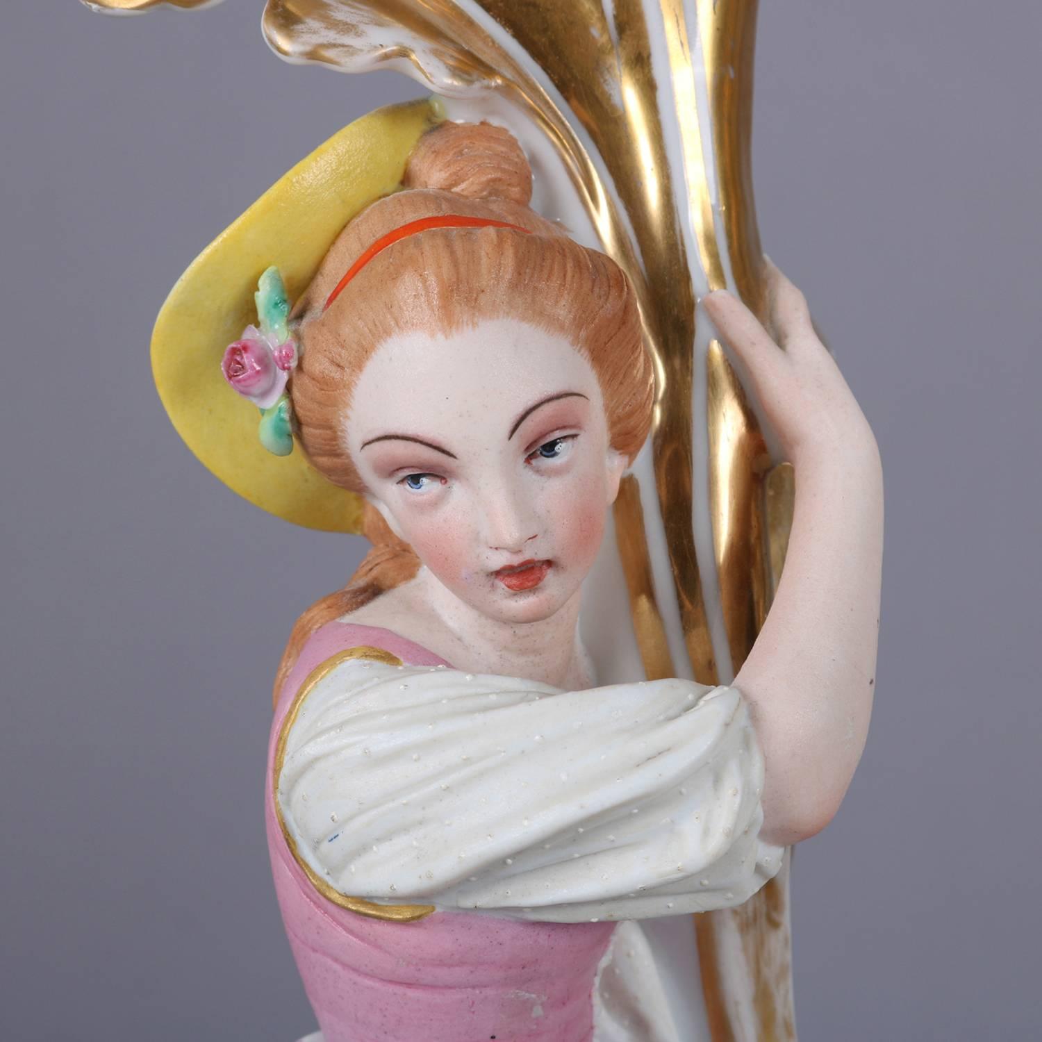 Pair of antique French Old Paris figural porcelain spill vases feature applied courting couple in garden setting, hand-painted and with gilt highlights, circa 1870.

Measure: 17