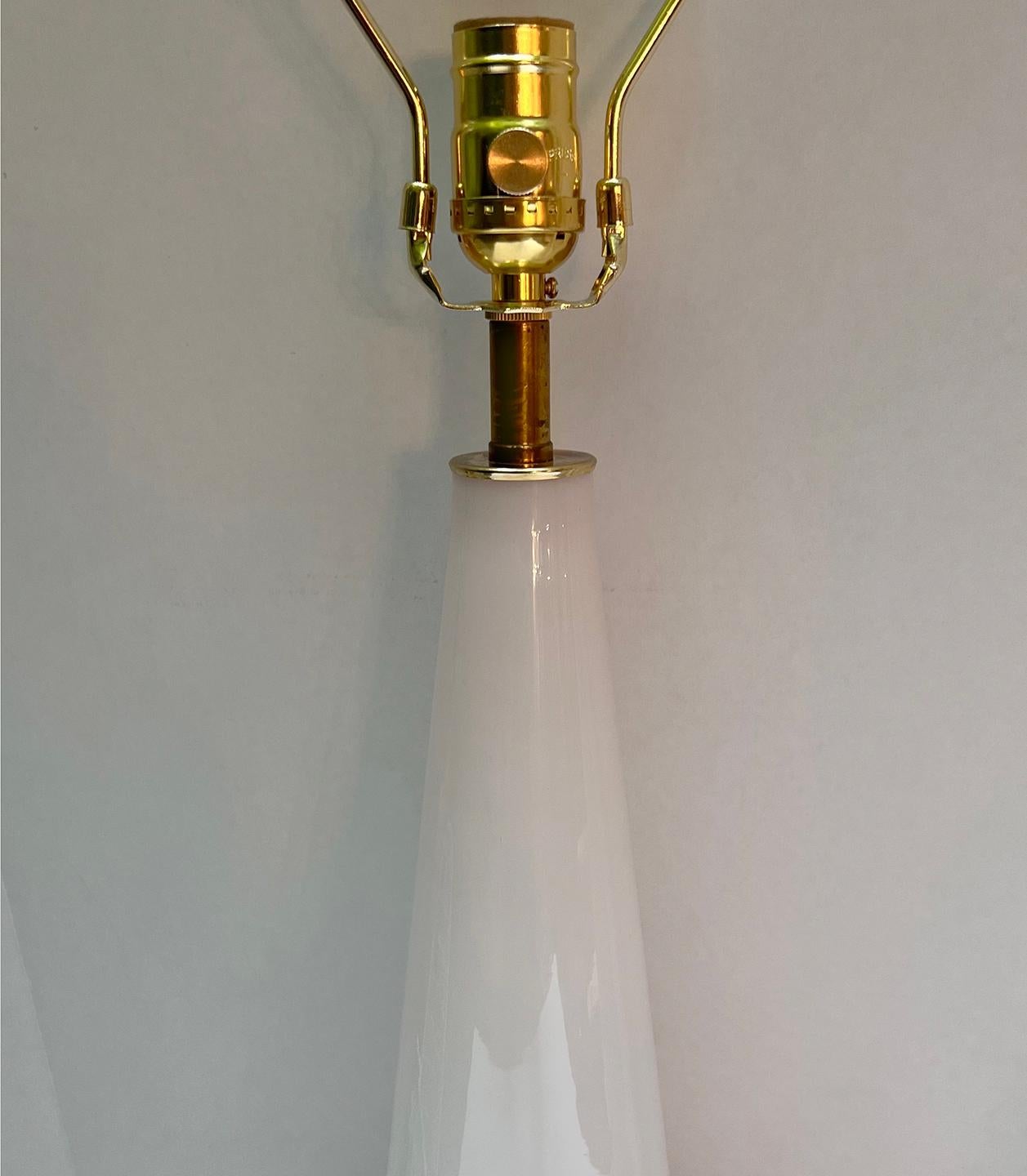 Pair of circa 1940's French pink opaline table lamps with gilt bases.

Measurements:
Height of body: 19.5