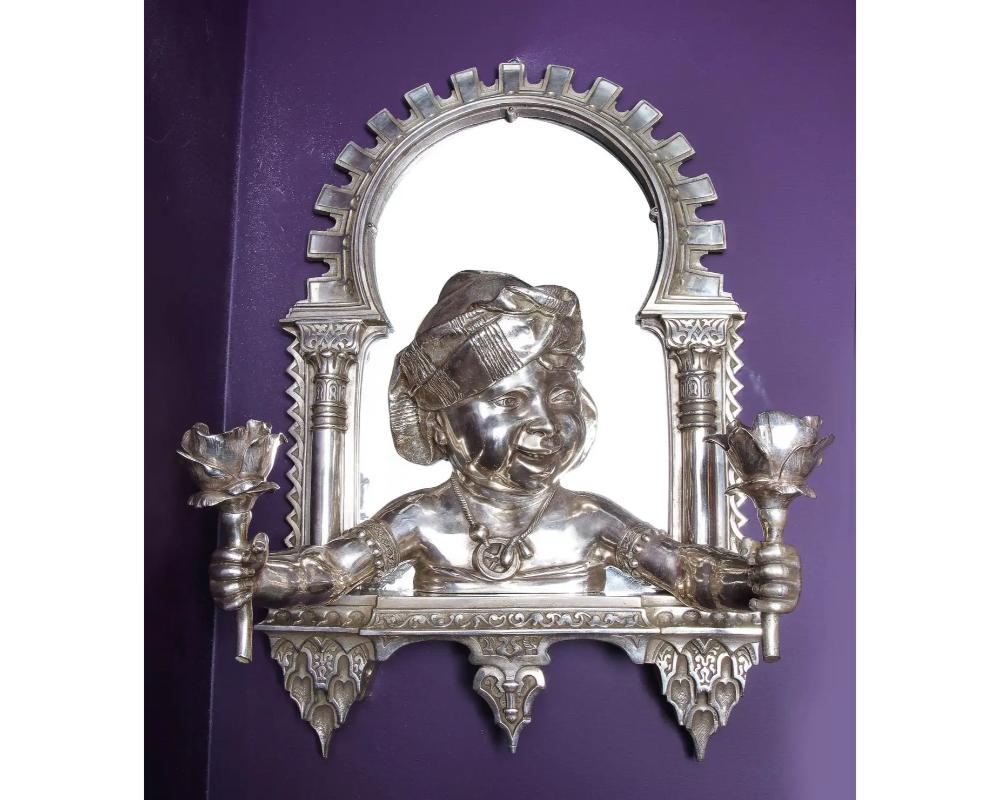 A large pair of French orientalist silvered bronze two-light wall appliqués or sconces or mirrors in the Alhambra / Moorish design, 

circa 1880. 

In the manner of Gustave-Joseph Chéret (1838-1894) A French sculptor and ceramist. 

And also