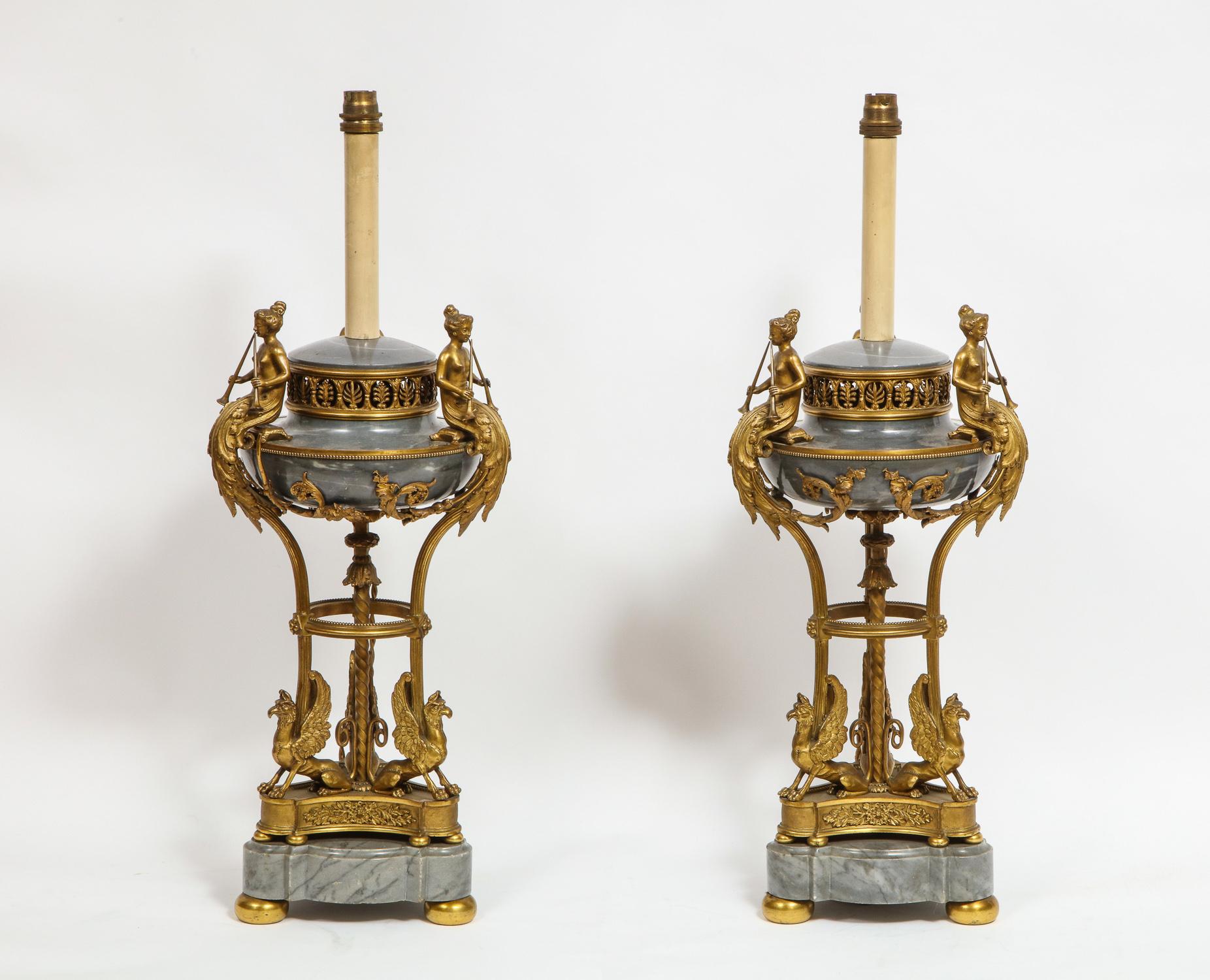 A rare pair of Louis XVI style, French ormolu bronze and gray marble brule parfums / vases converted to lamps,

Attributed to Paul Sormani Paris, circa 1880

Each with circular lid, above a pierced anthemion rim, the shallow body mounted with