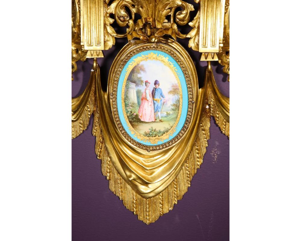 An exceptional pair of French ormolu bronze and turquoise Sèvres Porcelain wall brackets appliques, circa 1880  

Very high quality bronze, very solid.  

Each with partial gilt and polychrome decorated oval Sèvres- porcelain plaques of courtship