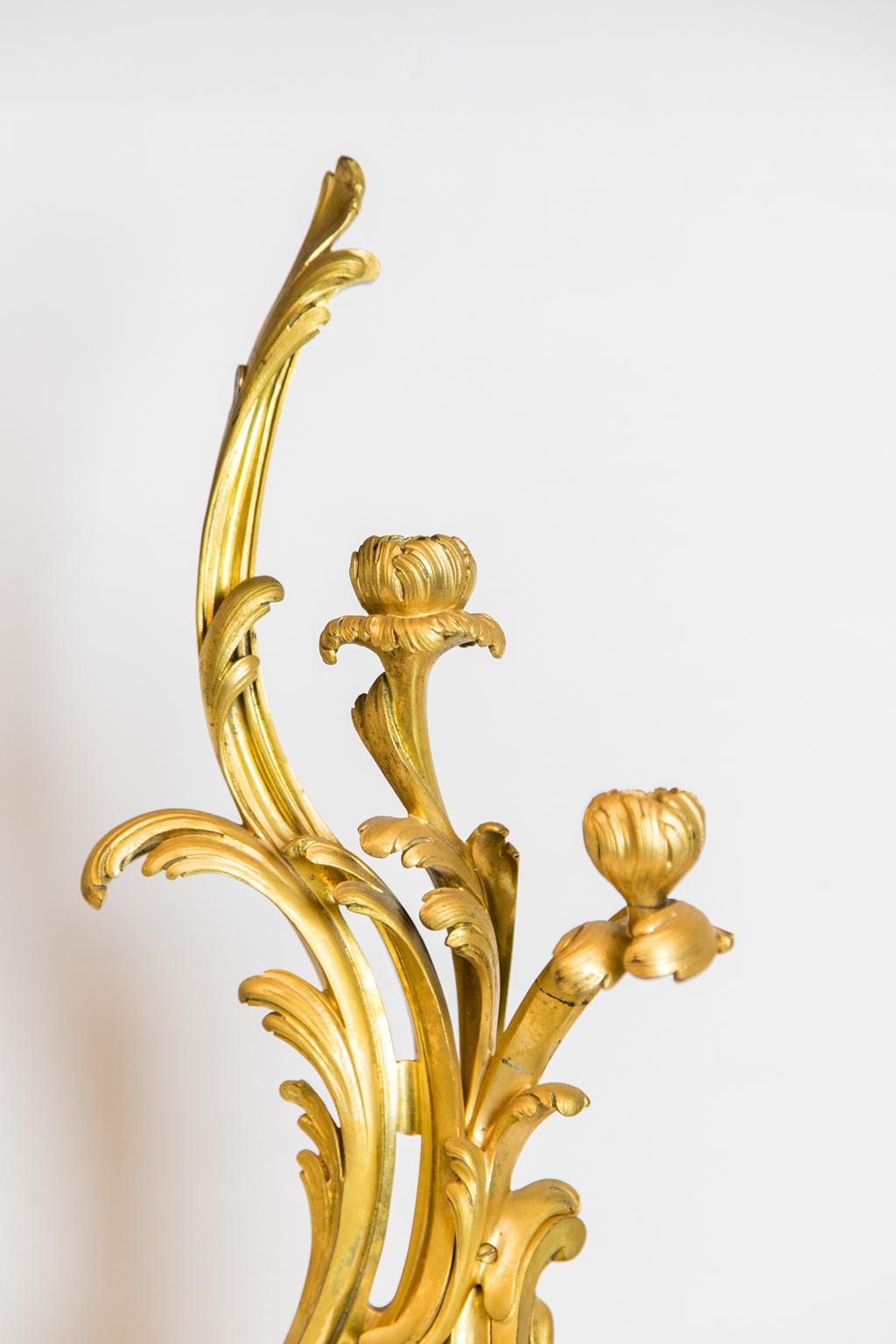 Pair of French ormolu candelabra, resting on a Verde marble base.