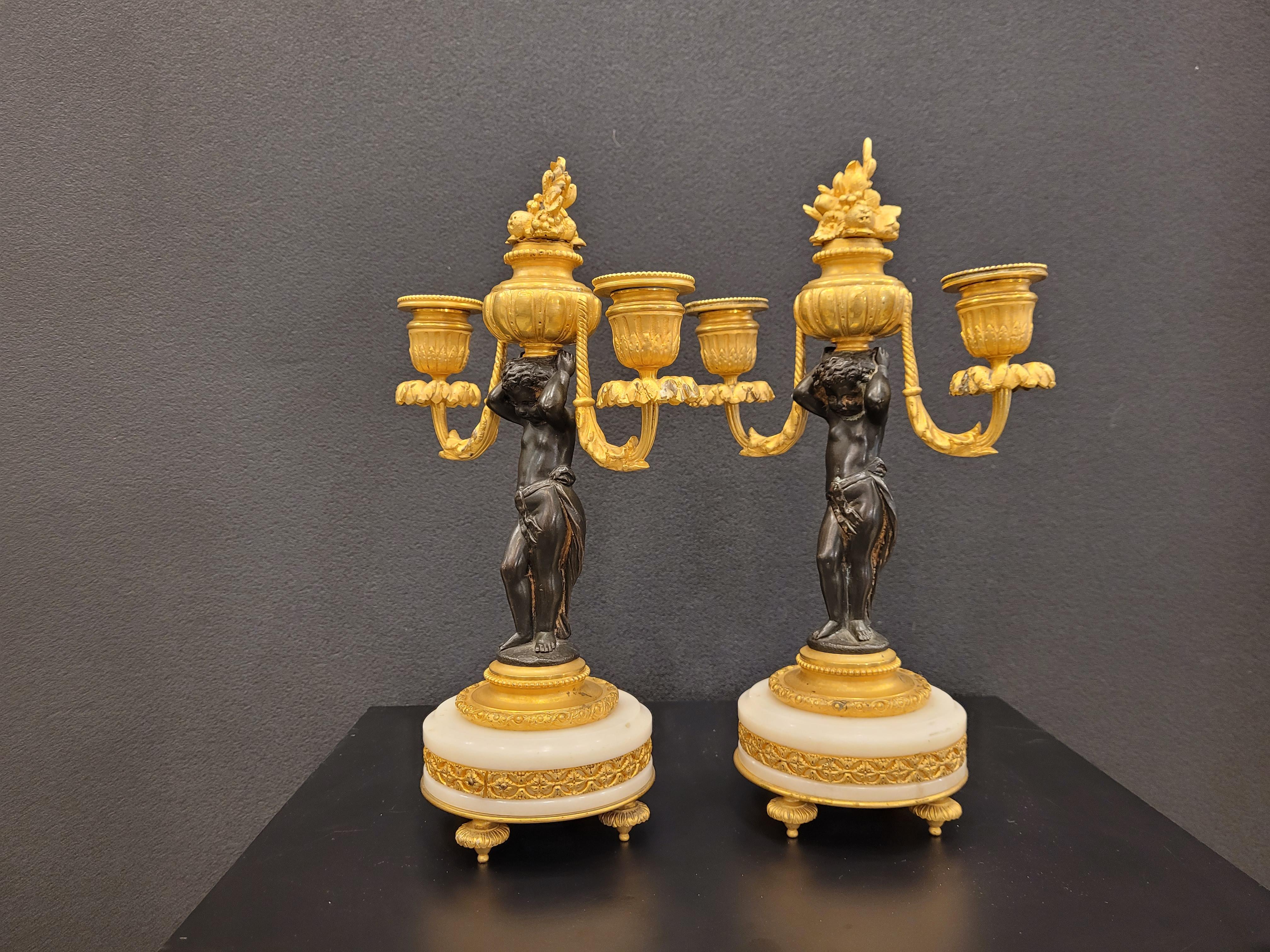Late 19th Century Pair of  French Ormolu  marble bronze candlesticks gilt bronze putti For Sale