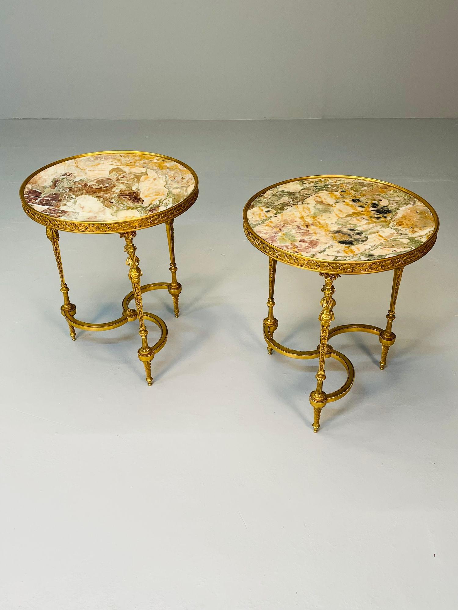 Pair of French Ormolu Marble Gueridons, Circular, 19th Century; Attributed to Adam Weisweiler

A pair of the absolute finest jeweler quality bronze gueridons. The pair supporting marble tops inset in bronze on a tripod base with full figured