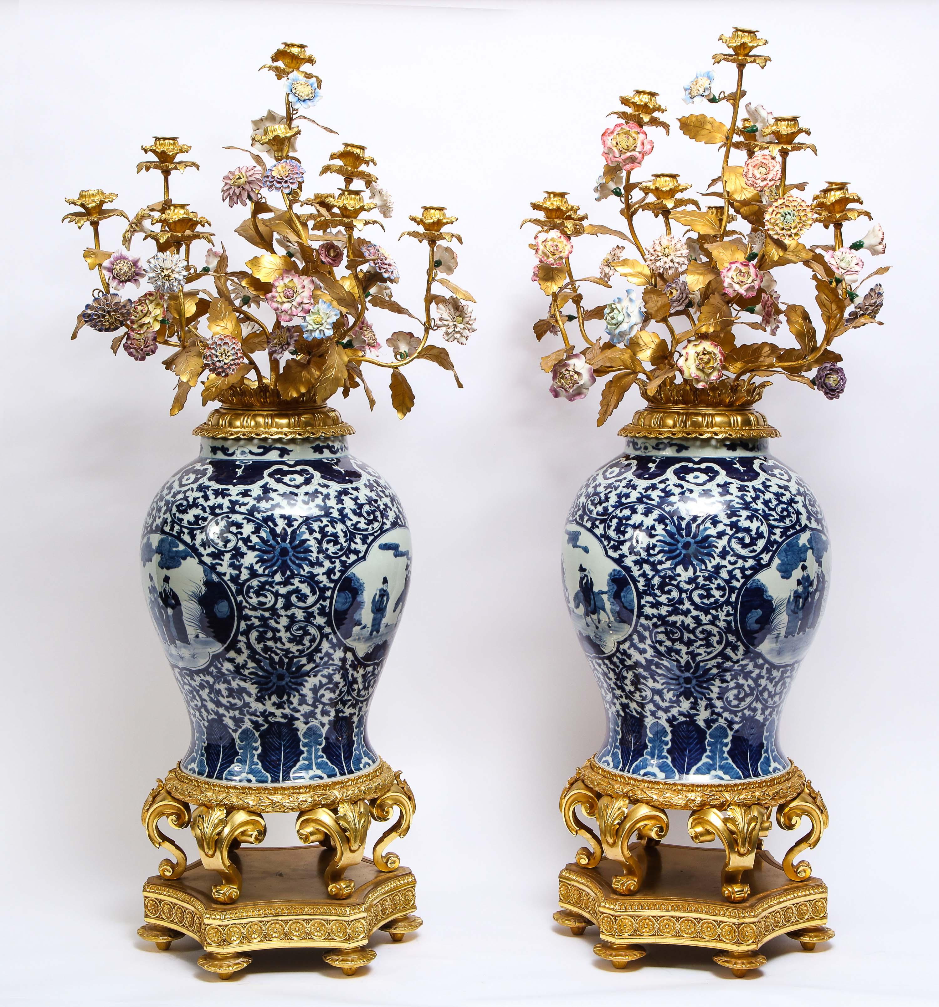 A monumental pair of Chinoiserie style French Ormolu mounted Chinese blue and white porcelain ten arm candelabras. These are truly a beautiful and monumental pair of candelabras. The body is a beautiful blue and white porcelain made in China with