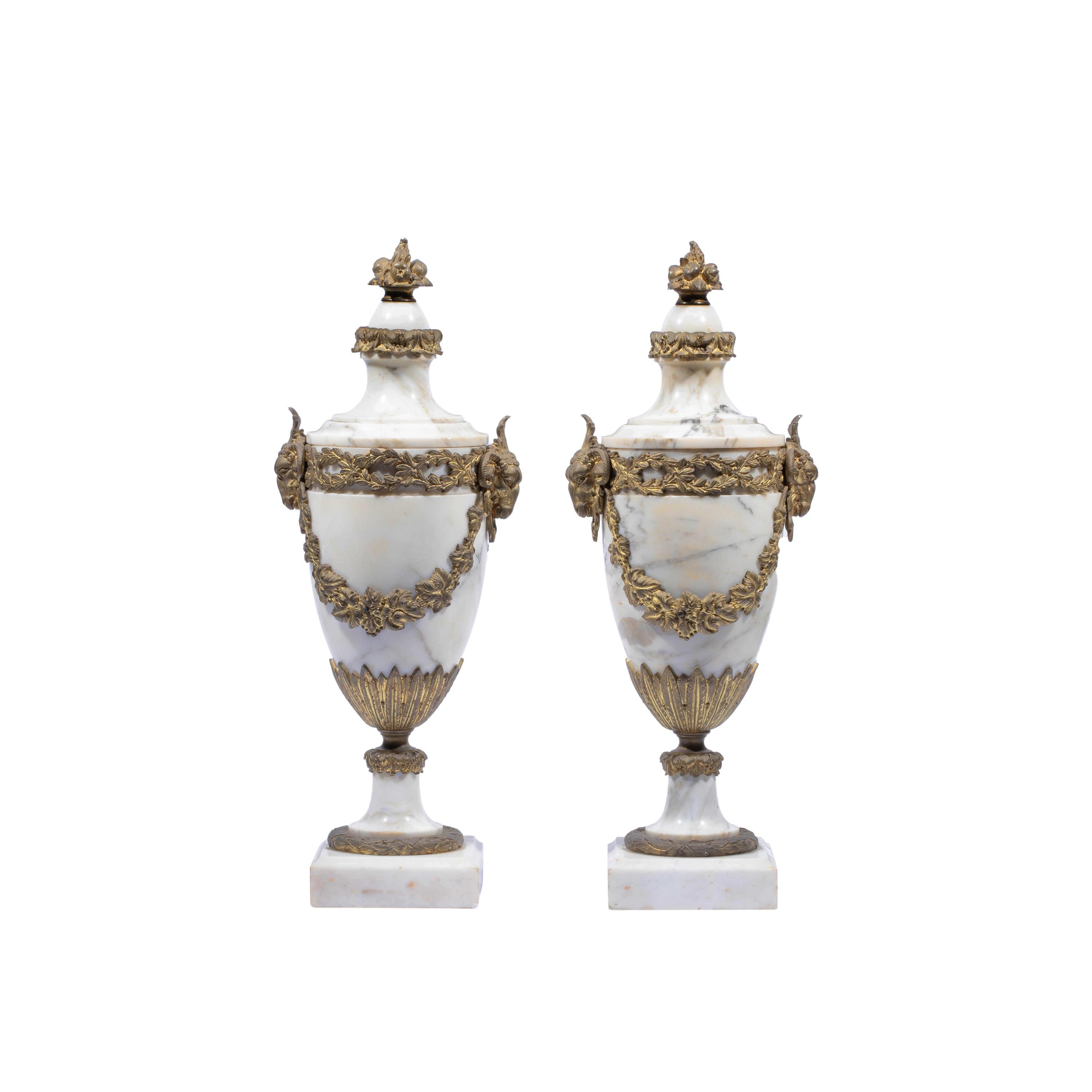 Pair of French Ormolu Mounted White Marble Vases, Circa 1900
Having ormolu mounts with rams head on either side if each urn shaped vase.
