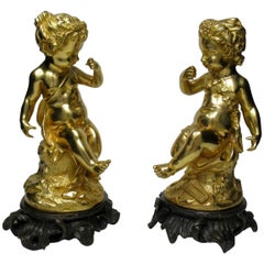 Pair of French Ormolu Patinated Bronze Seated Cherubs Rococo Putto, 19th Century