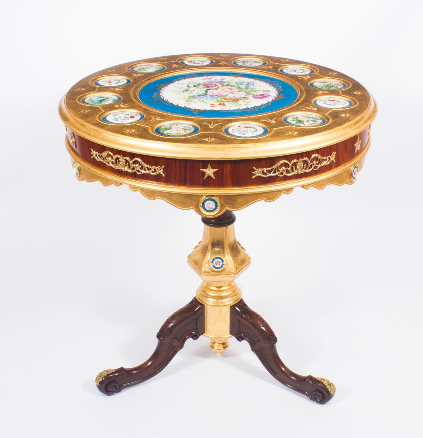 This is an exquisite pair of ormolu and Sevres style porcelain occasional tables in the fabulous Louis XVI manner dating from the late 20th century. 

The circular gilded tops are each inset with a large central Sevre style porcelain plaque,
