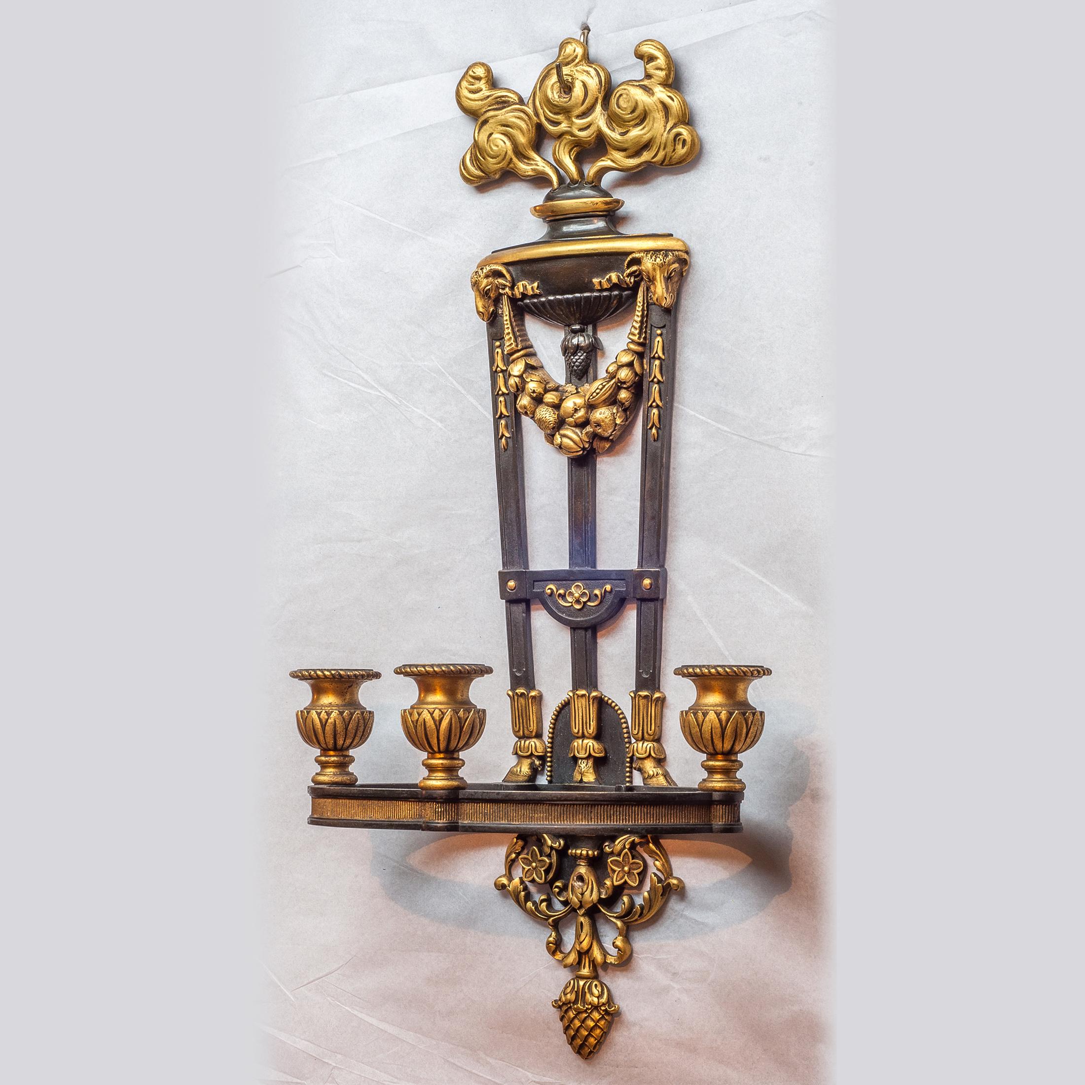 Fine pair of French Ormolu three-light wall sconces with rams head.

Origin: French
Date: 19th century
Dimension: 21 1/2 x 11 1/4 x 6 1/2 inches.