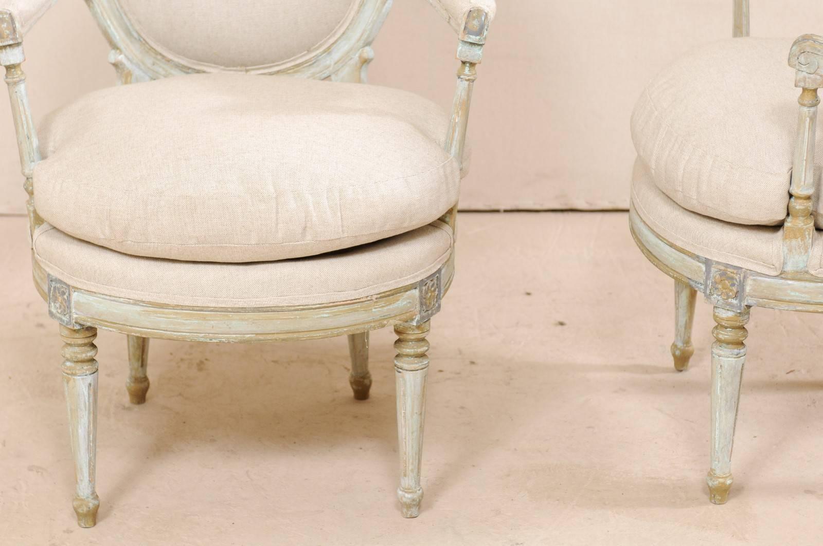 Pair of French Oval-Back Bergère Chairs with Delicately Carved Floral Motifs 3