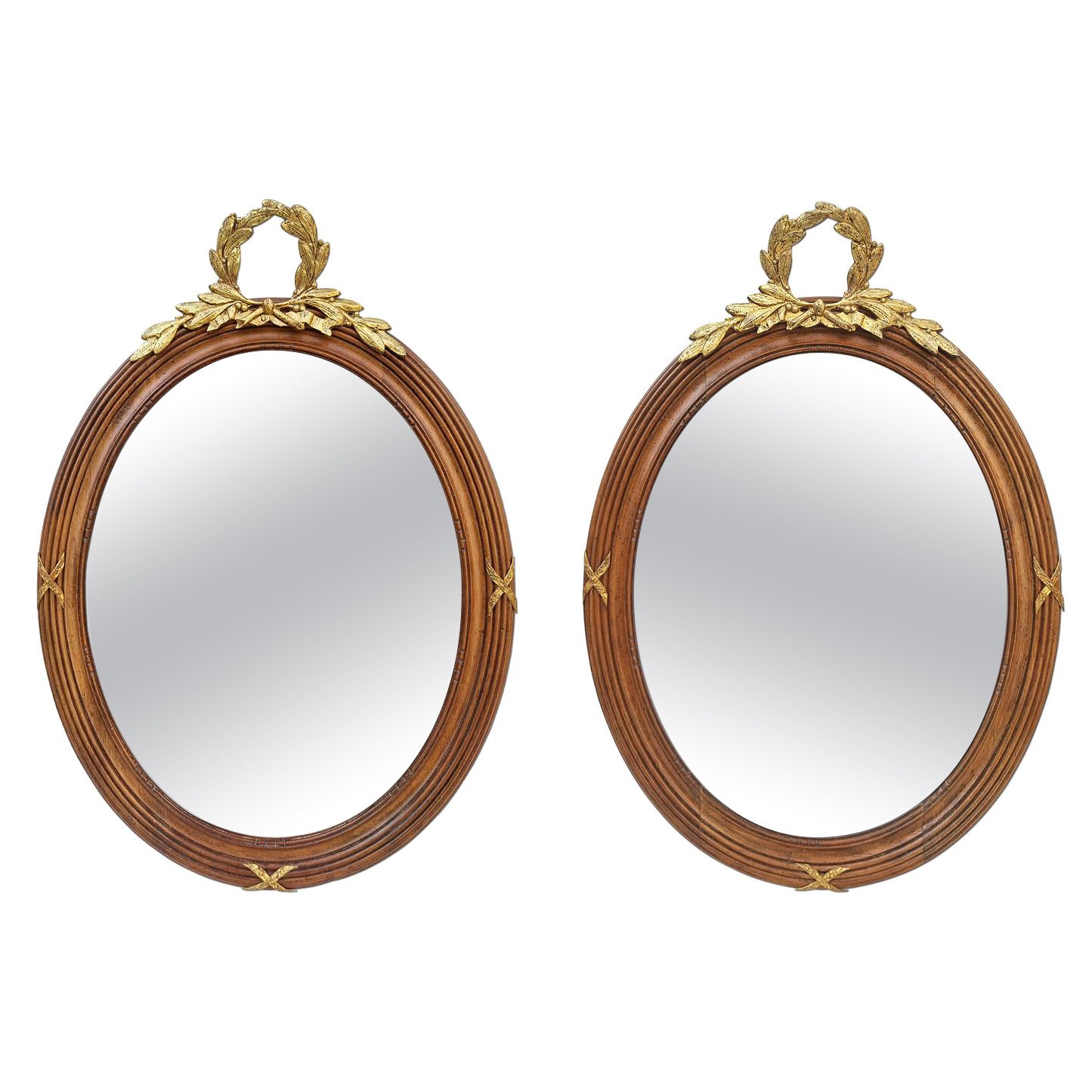 Coppia di specchi ovali francesi in legno intagliato e bronzo dorato, circa 1890