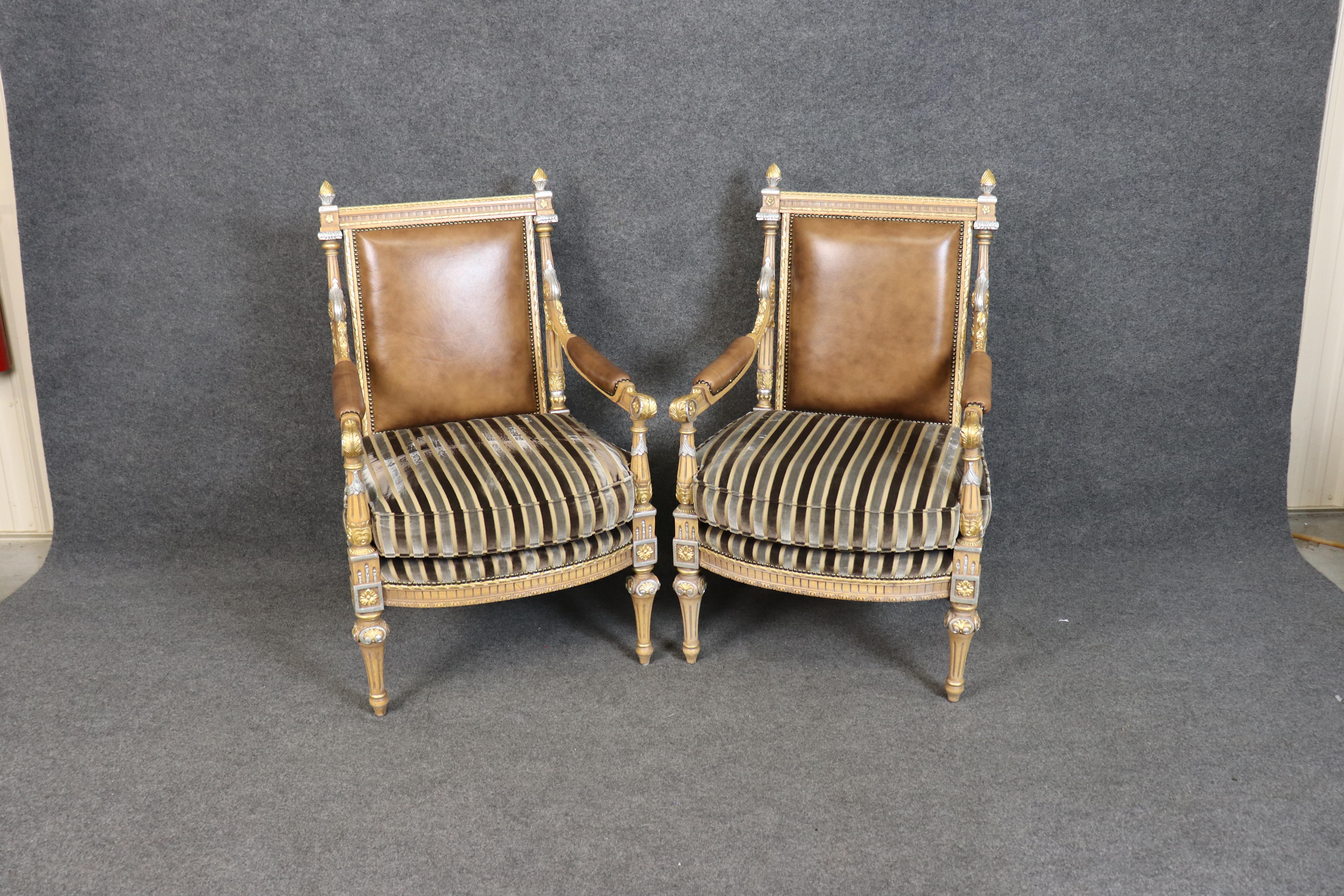 Bring timeless grandeur to your space with this exquisite pair of French Louis XVI-style Armchairs, crafted in the 1960s and exuding regal elegance. These formal accent chairs feature finely carved hardwood frames, finished in a tasteful combination