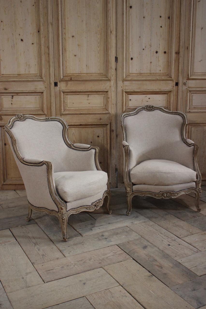 A charming pair of circa 1930s french painted armchairs in the Louis XVI taste, retaining the original paint and having been reupholstered by us in a neutral linen with studs. 

Measurements: 41cm High (floor to seat)