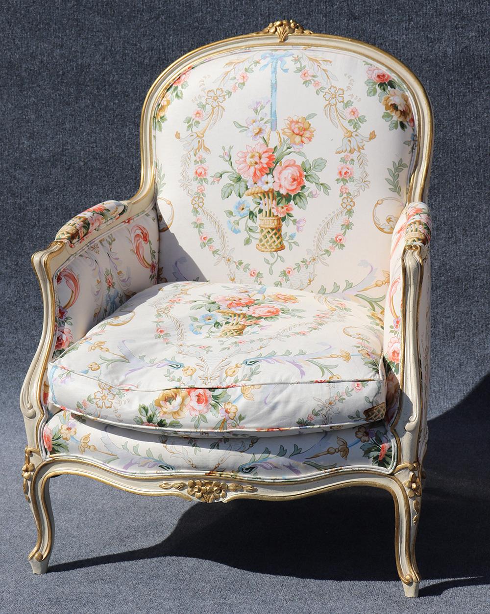 Pair of French distressed painted bergère chairs with goose down filled cushions and gold leaf accents.