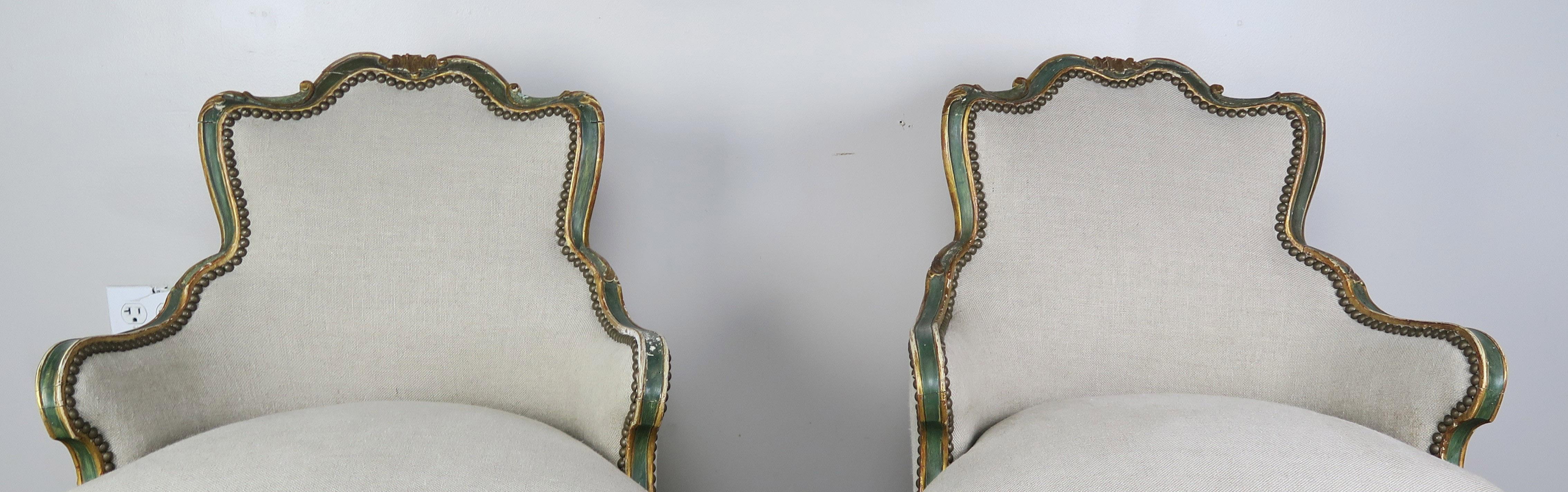 French Provincial Pair of French Painted and Parcel Gilt Armchairs