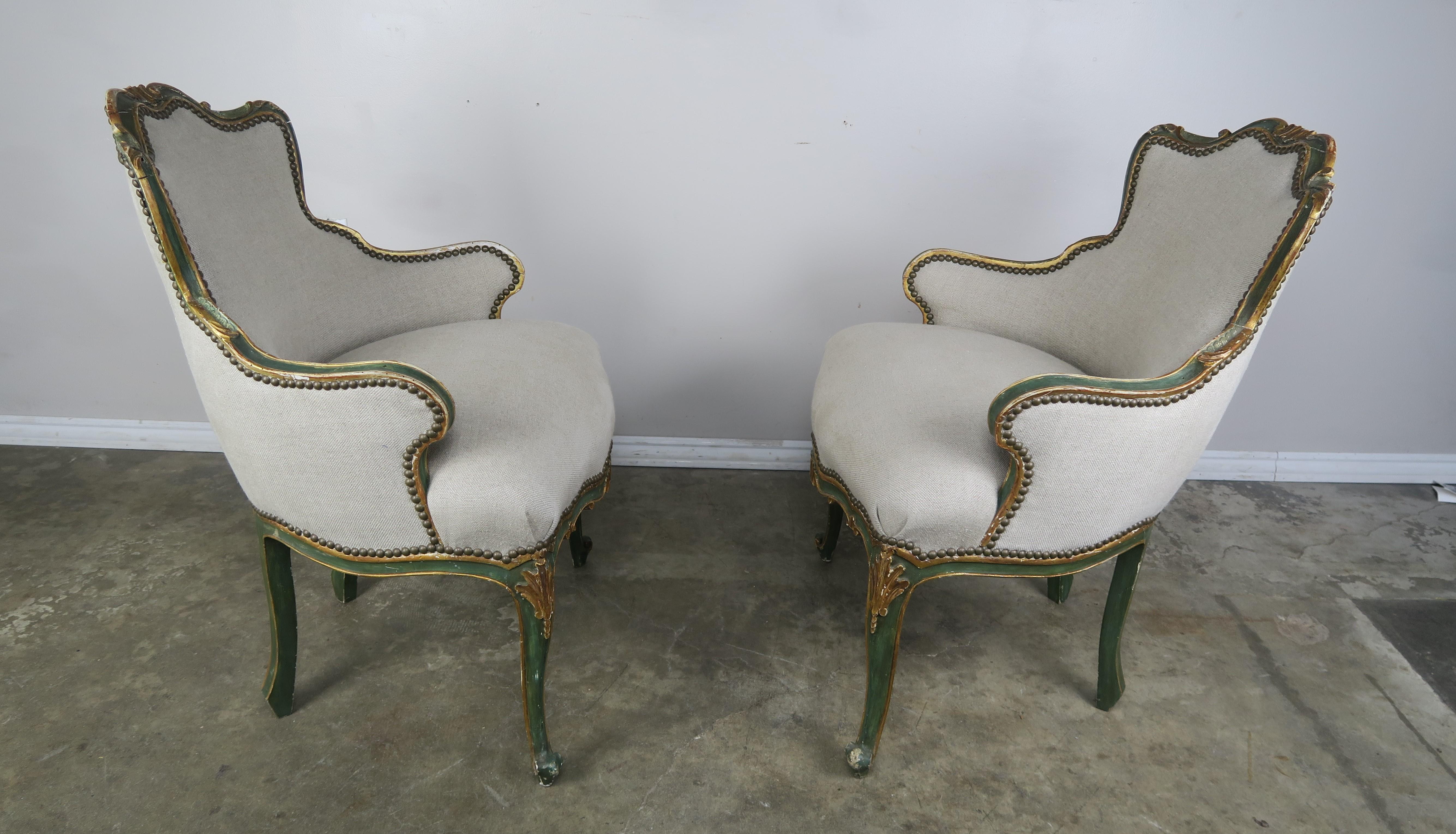 Early 20th Century Pair of French Painted and Parcel Gilt Armchairs