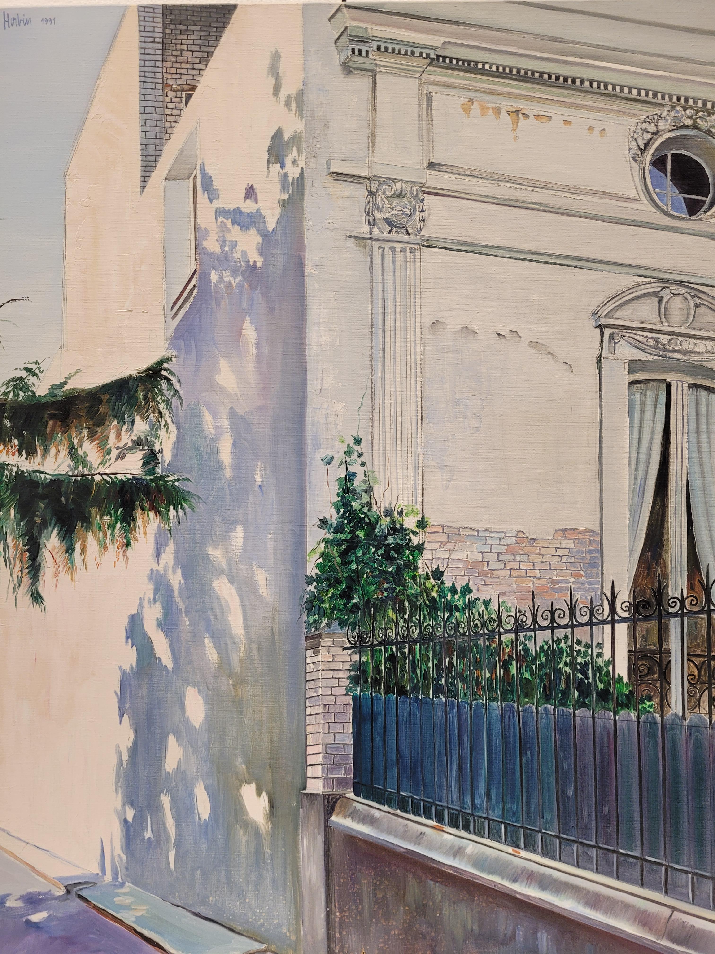 Exceptional pair of oil paintings on canvas featuring two views of elegant homes in broad daylight. They are titled The Shadow of the Tree on the White Facade and The House with the Blue Door.

Both feature a distinctive composition, adopting a