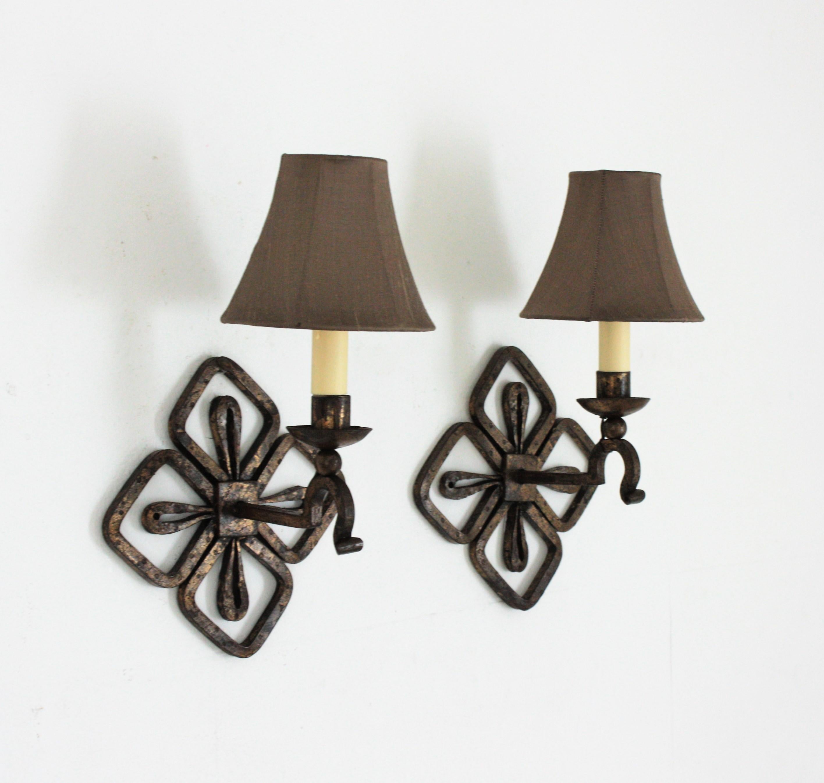Hollywood Regency Pair of French Parcel Gilt Iron Wall Sconces with Fleur de Lis Design