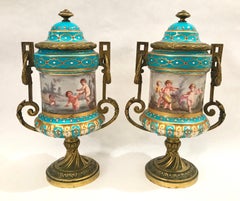 Pair of French Gilt Bronze Mounted Porcelain Lidded Urns