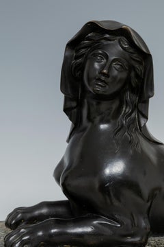 Pair of French Patinated Bronze and Gilt Bronze Mounted Sphinxes on Granite Base